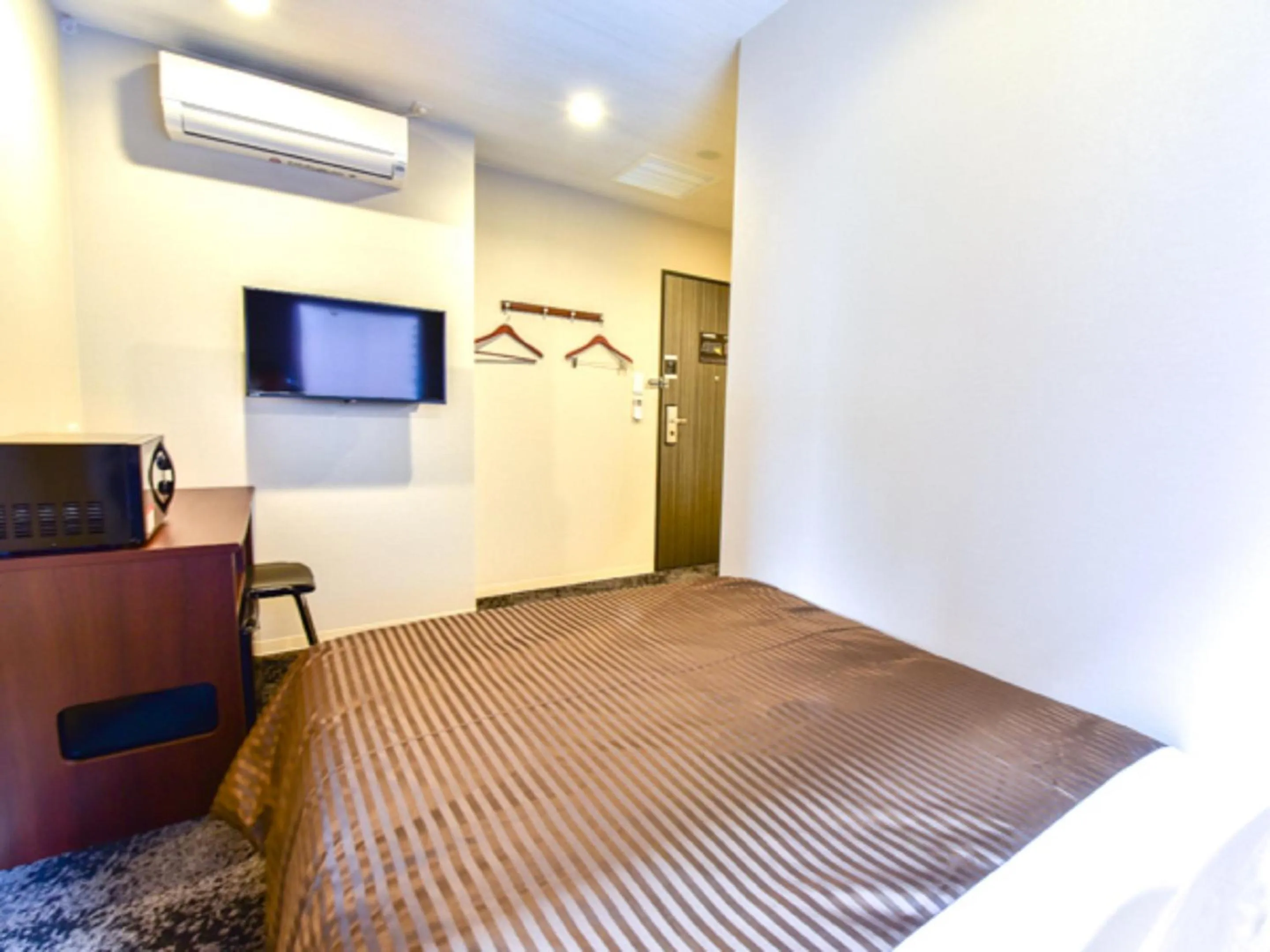 Bed in HOTEL LiVEMAX Fukuoka Tenjin West