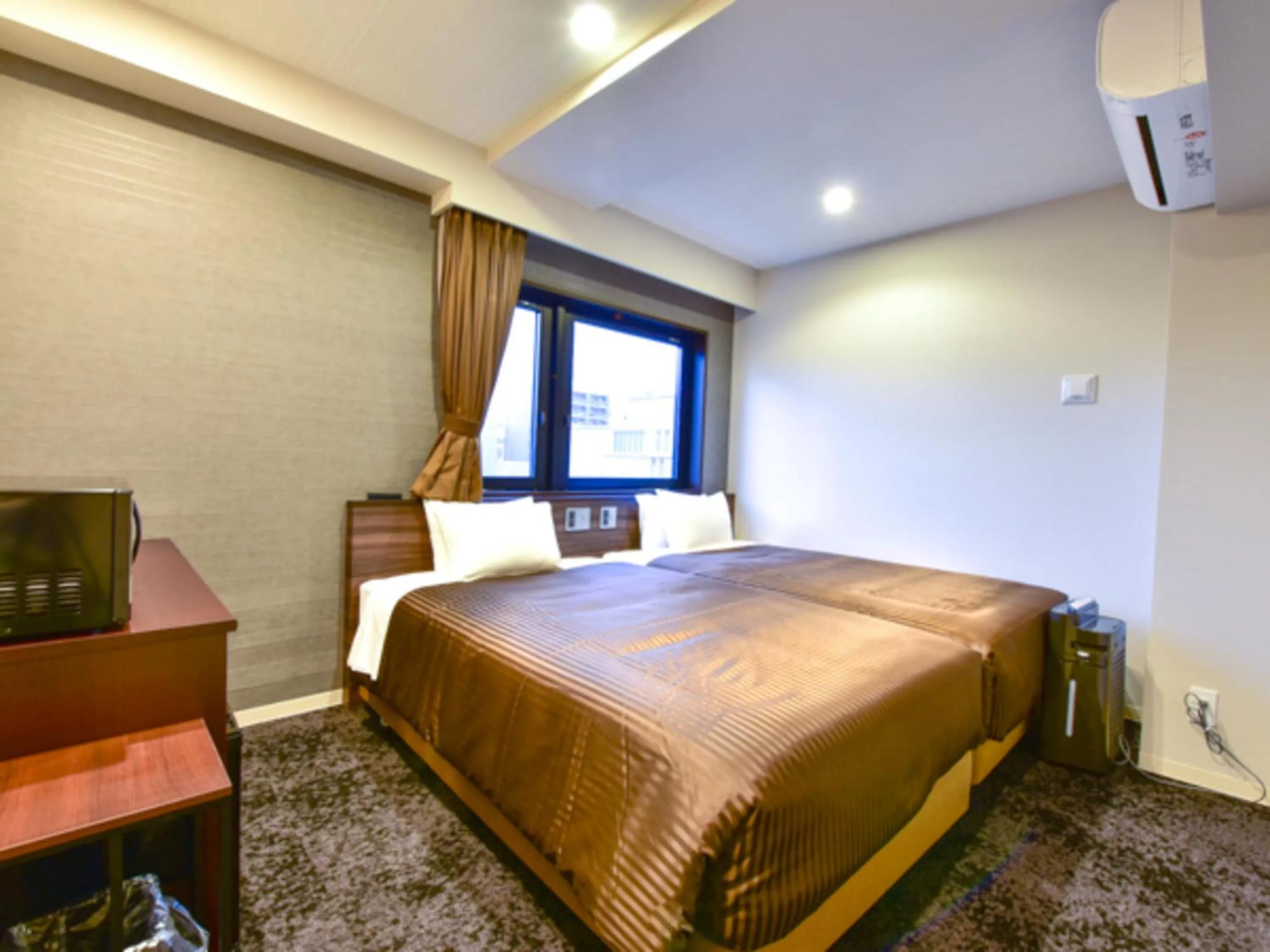 Bed in HOTEL LiVEMAX Fukuoka Tenjin West