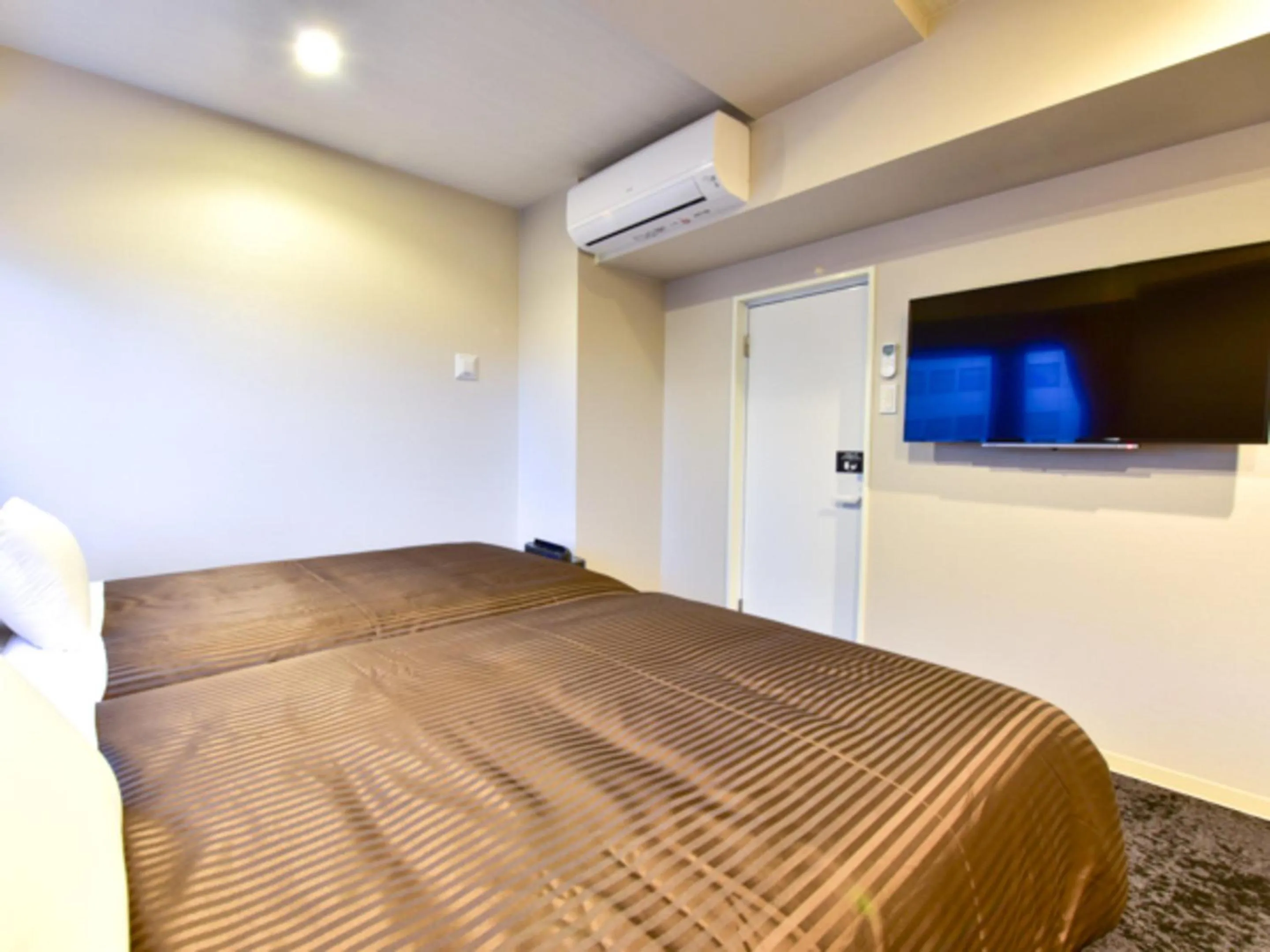 Bed in HOTEL LiVEMAX Fukuoka Tenjin West