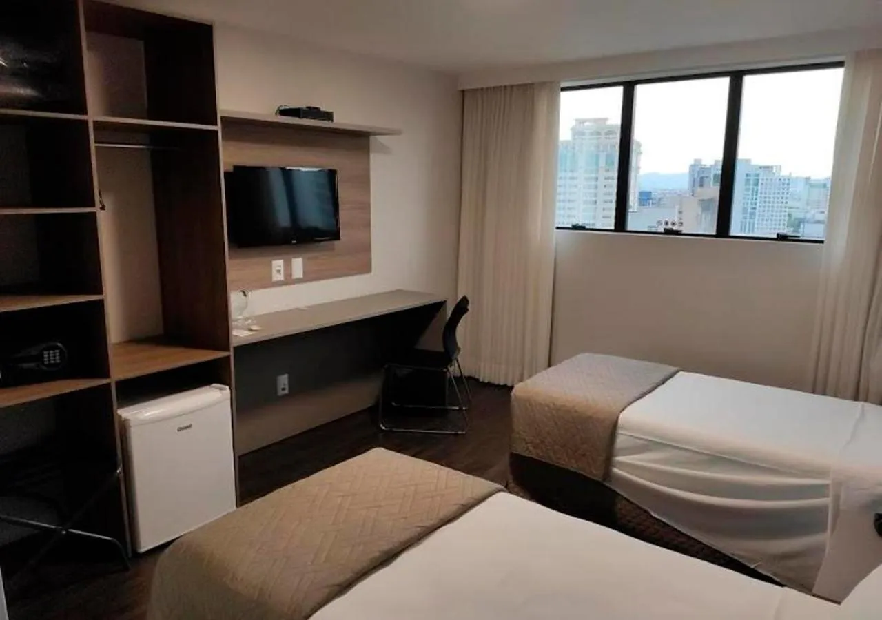 Communal lounge/ TV room, Bed in Hotel 7 Itajaí