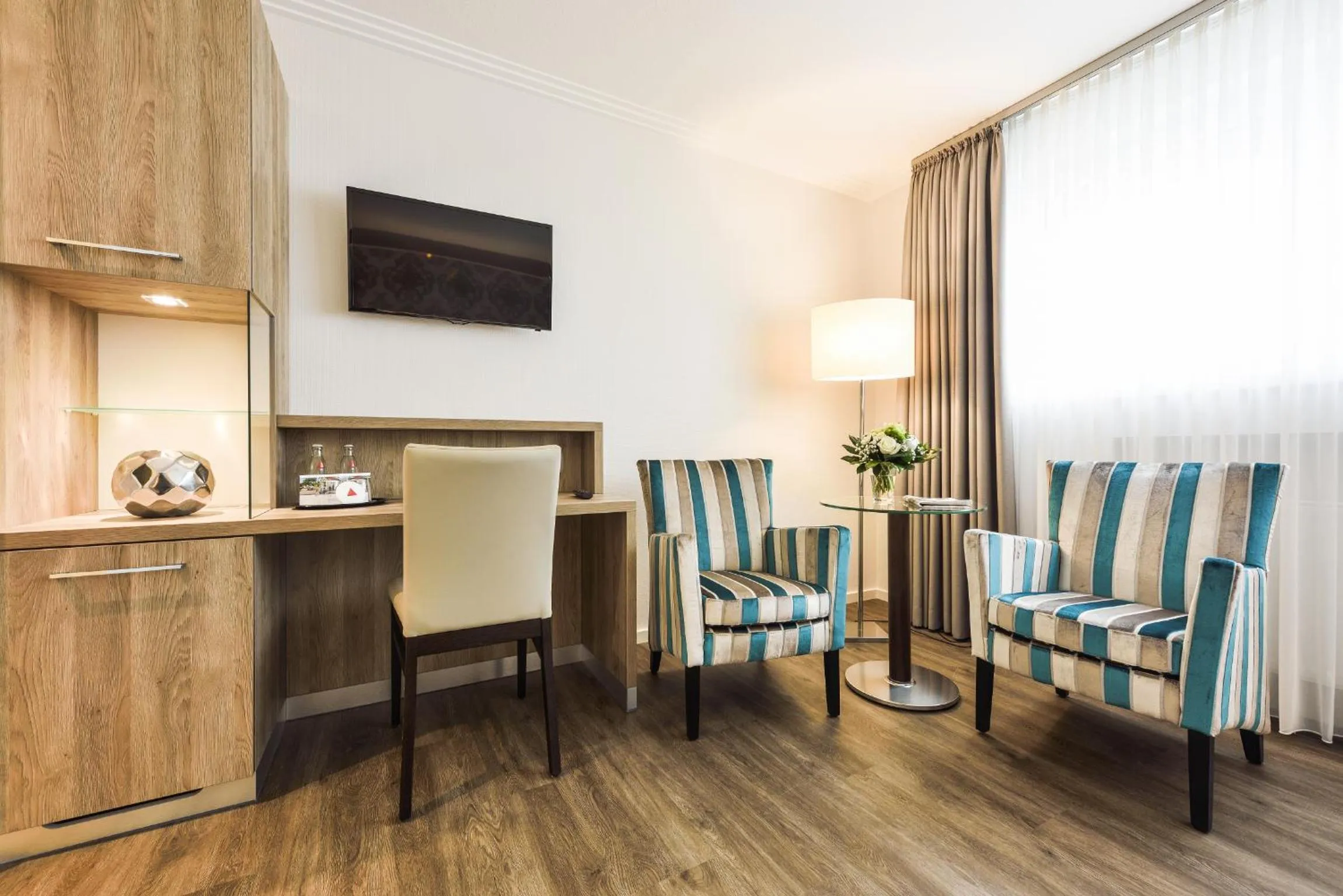 Communal lounge/ TV room in See und Sporthotel Ankum mit Lakeside Apartments