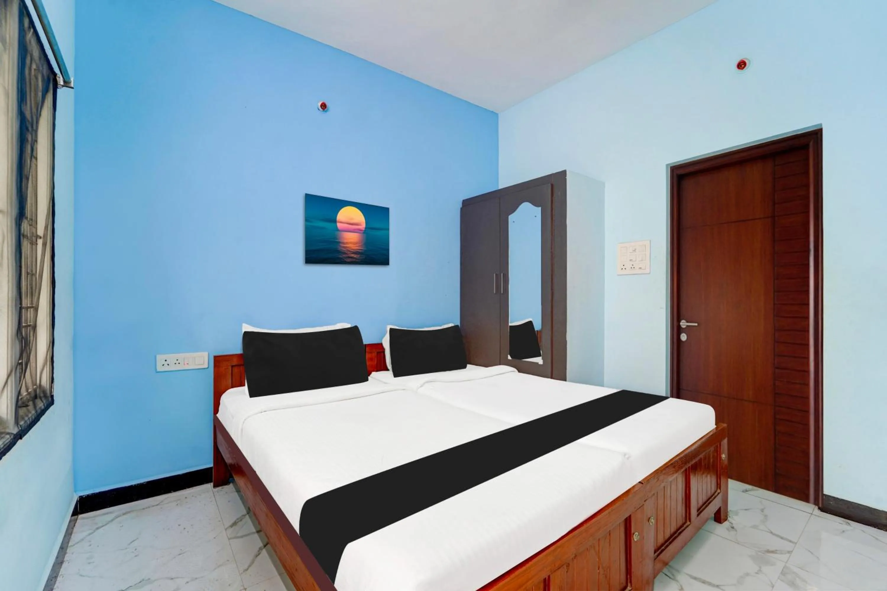 Bedroom in Super Hotel O Madurai Near Bus Stand