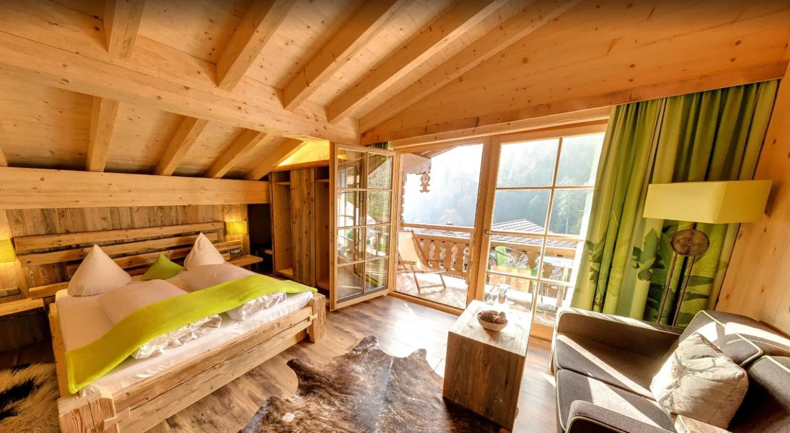 Living room, Bed in Feuriger Tatzlwurm Berghotel & Spa, BW Signature Collection