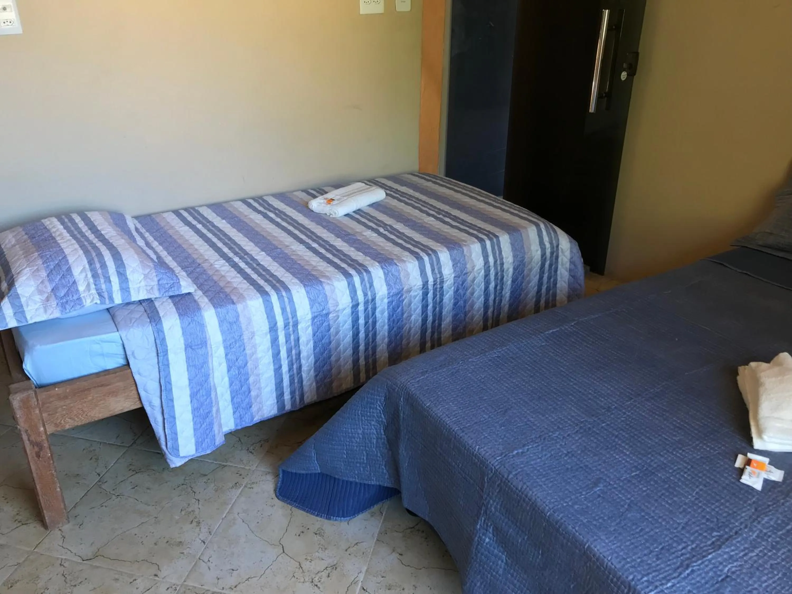 Bed in Pousada Floripes