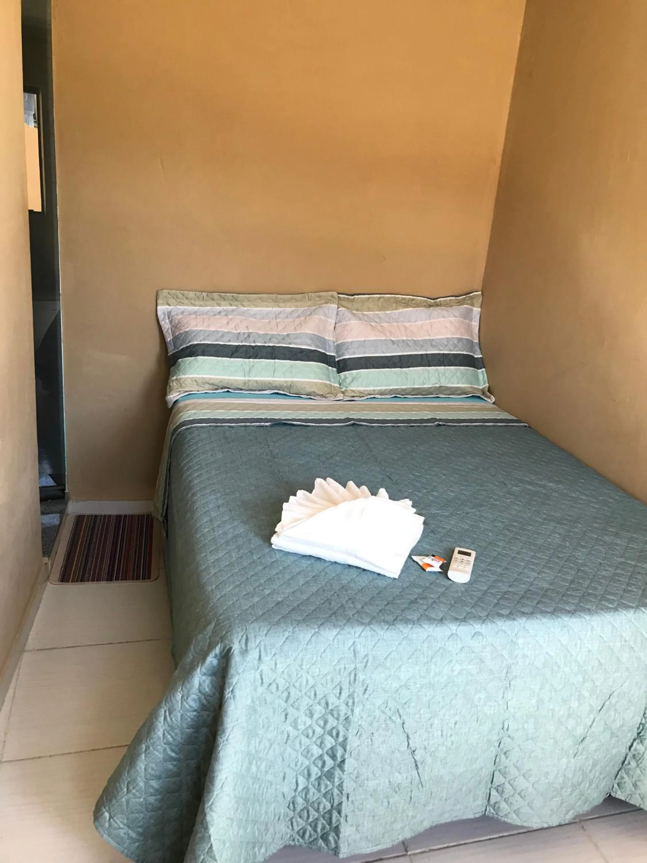 Bed in Pousada Floripes