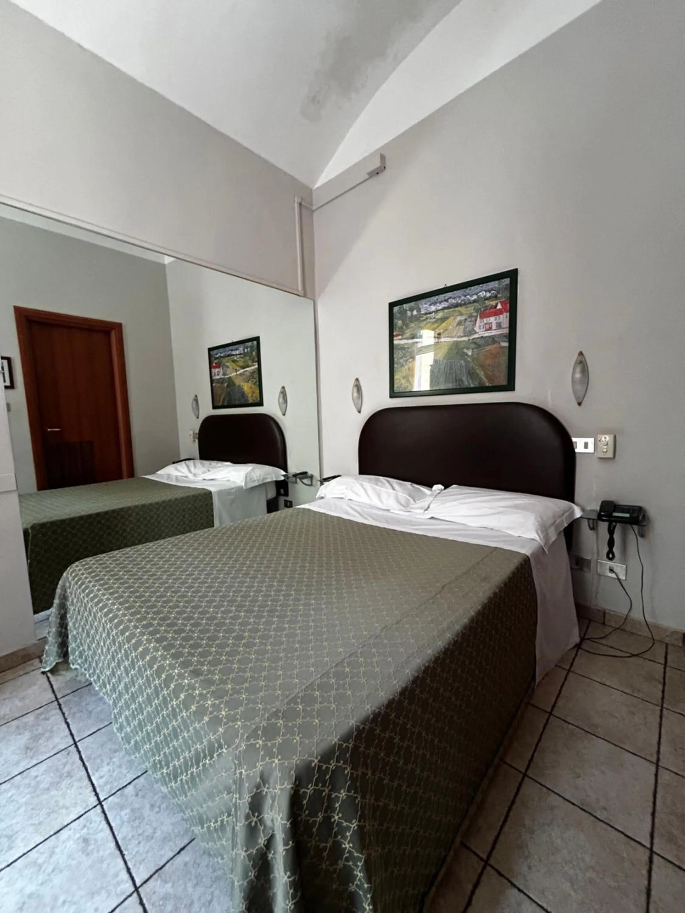 Bed in Hotel Ferrucci