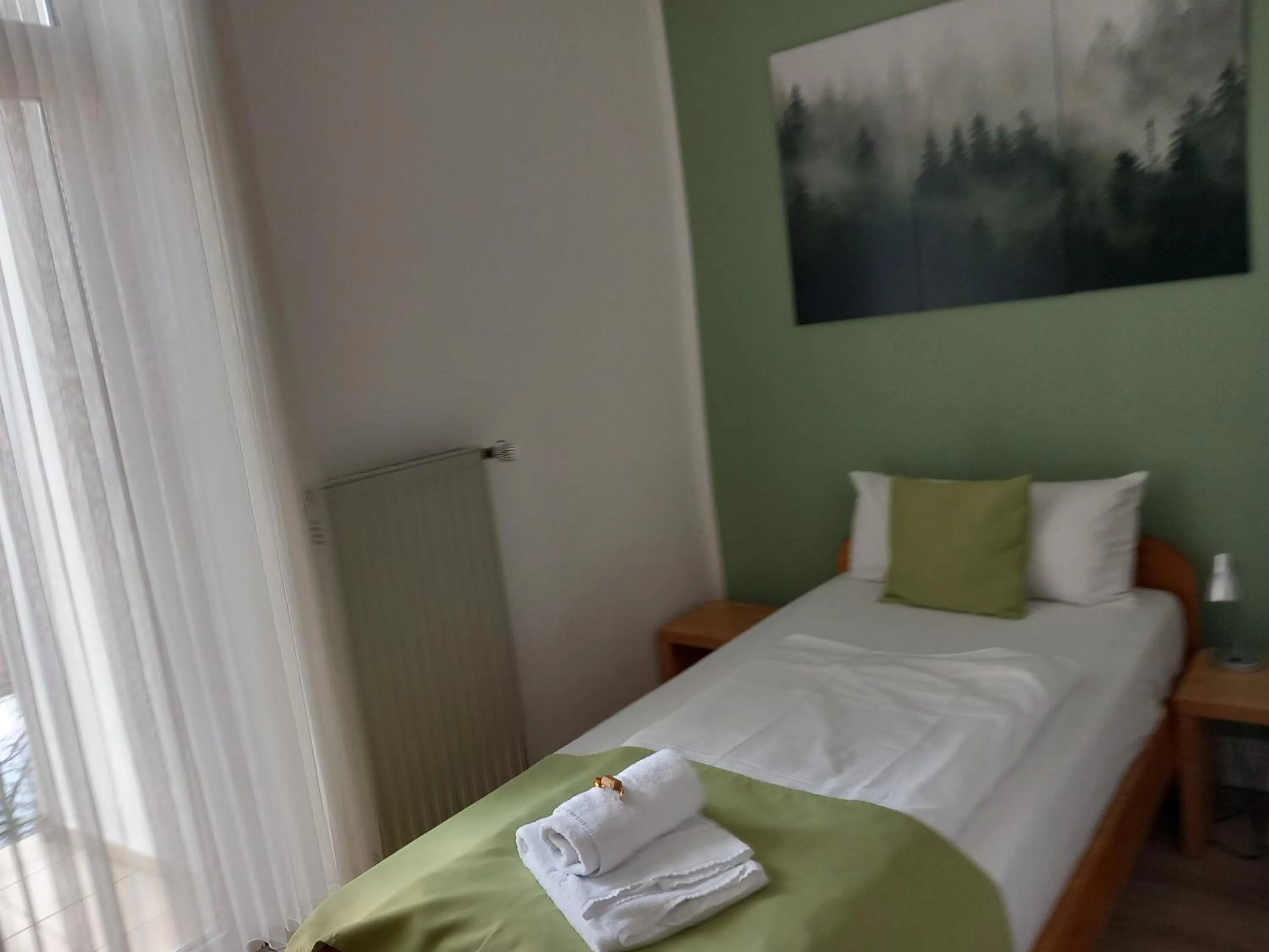 towels, Bed in Hotel Karolinger - Self Check-In