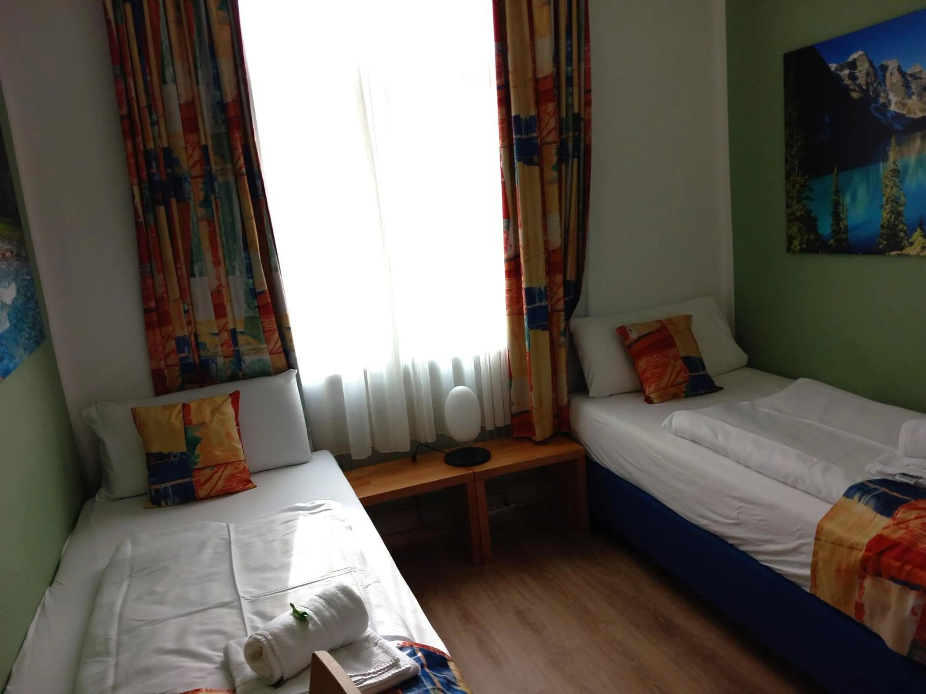 towels, Bed in Hotel Karolinger - Self Check-In