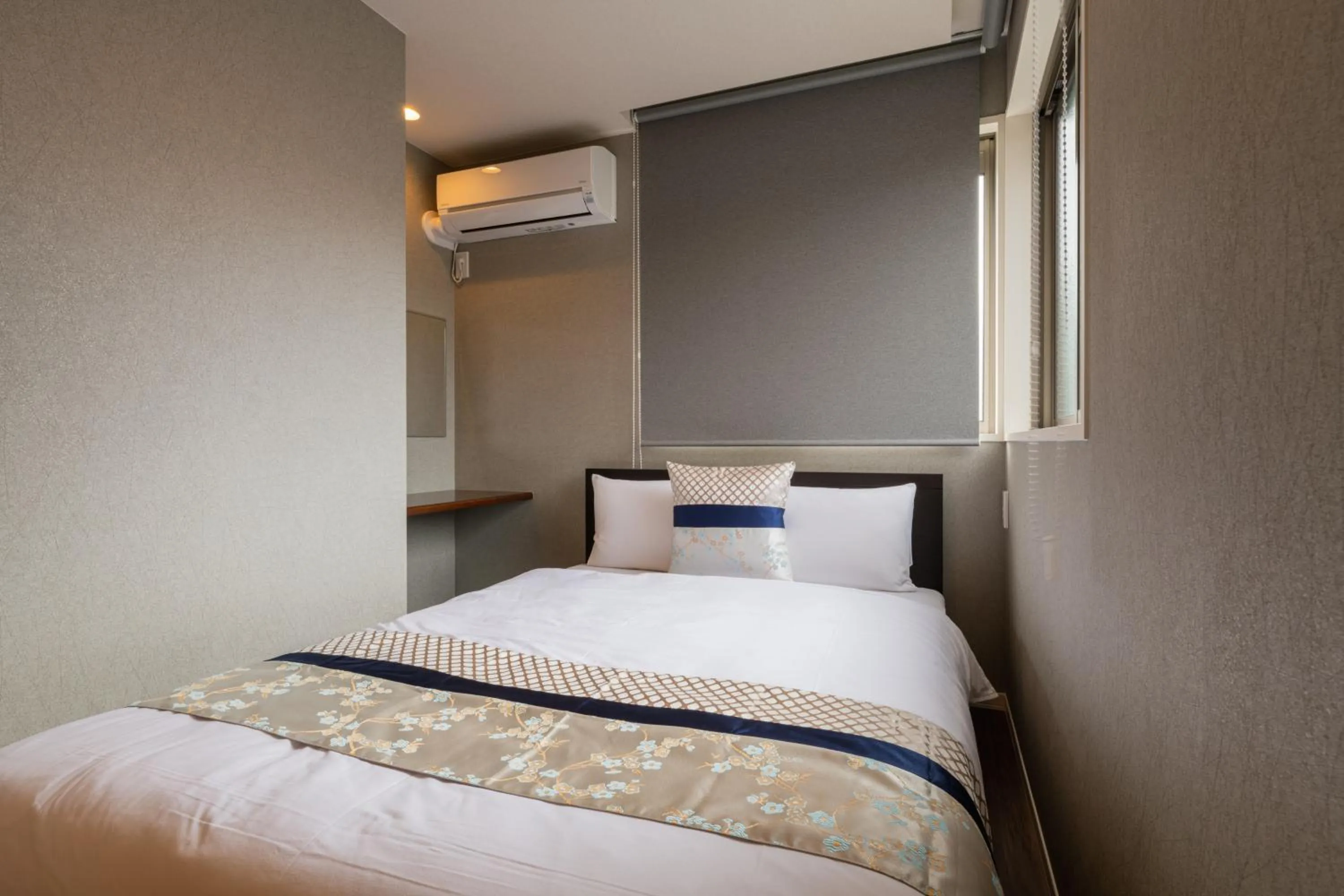 Bed in GRAND BASE Nagasaki Chukagai