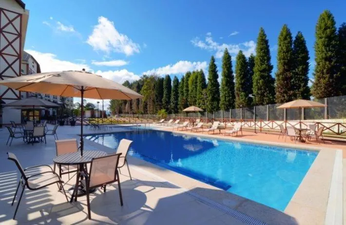 Swimming pool in Suíte Charmosa em Pedra Azul