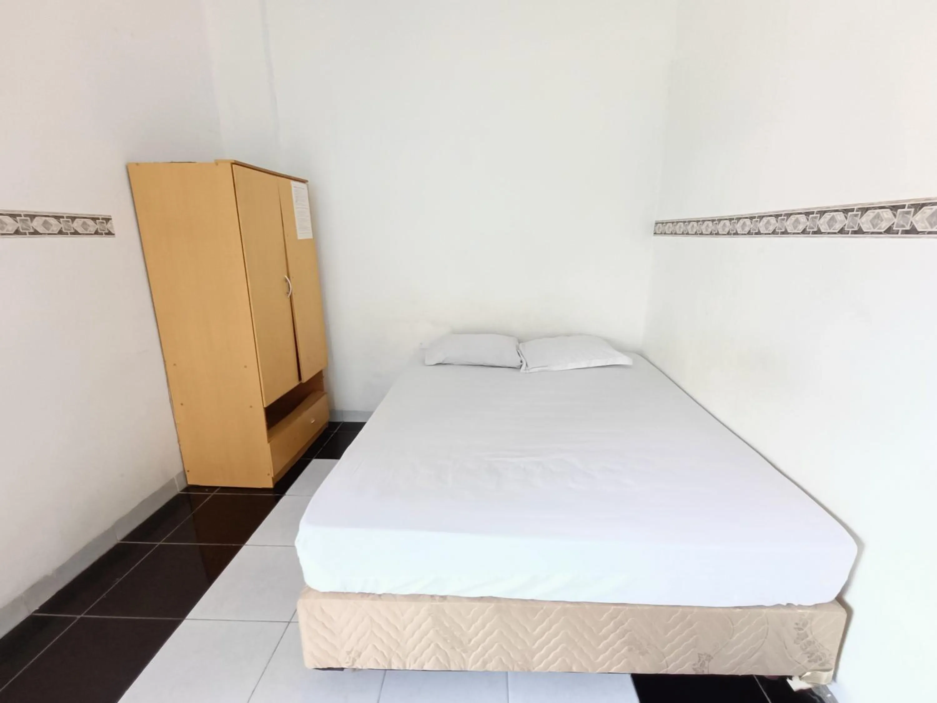 Bed in Bumi Merpati Residence Makassar Mitra RedDoorz