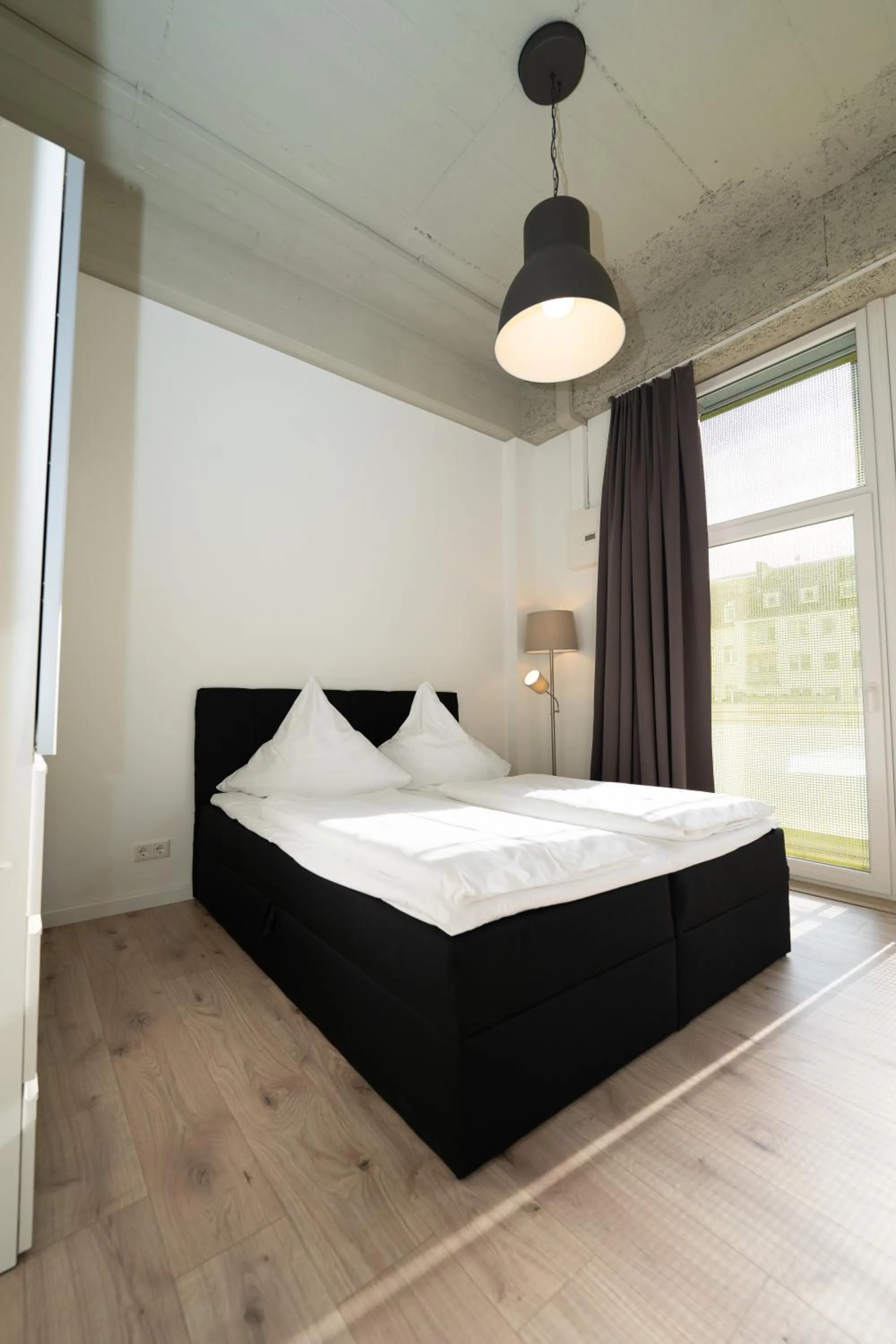 Bed in Das Loft Apartments