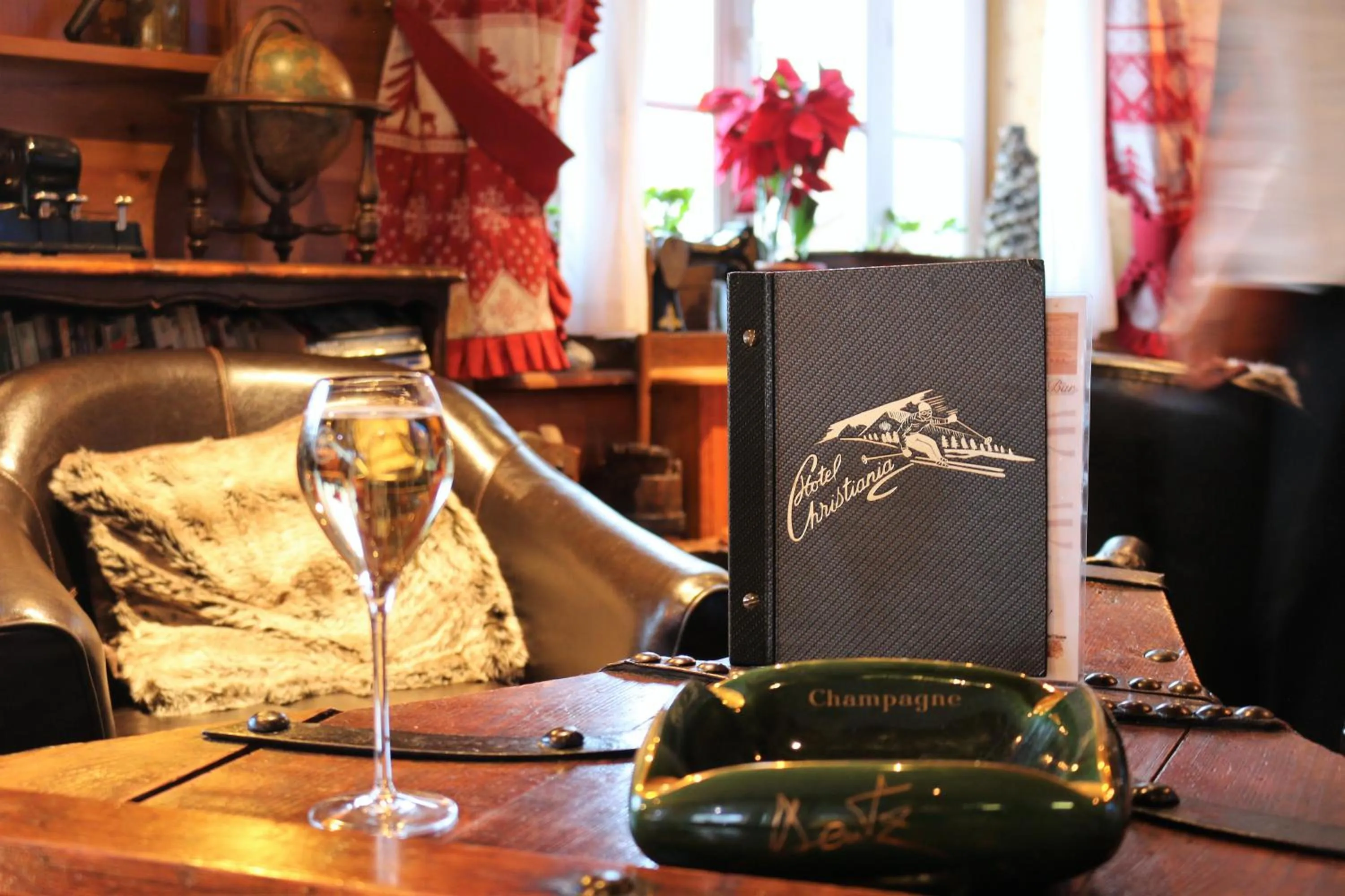 Communal lounge/ TV room in Logis Hôtel et Spa Le Christiania