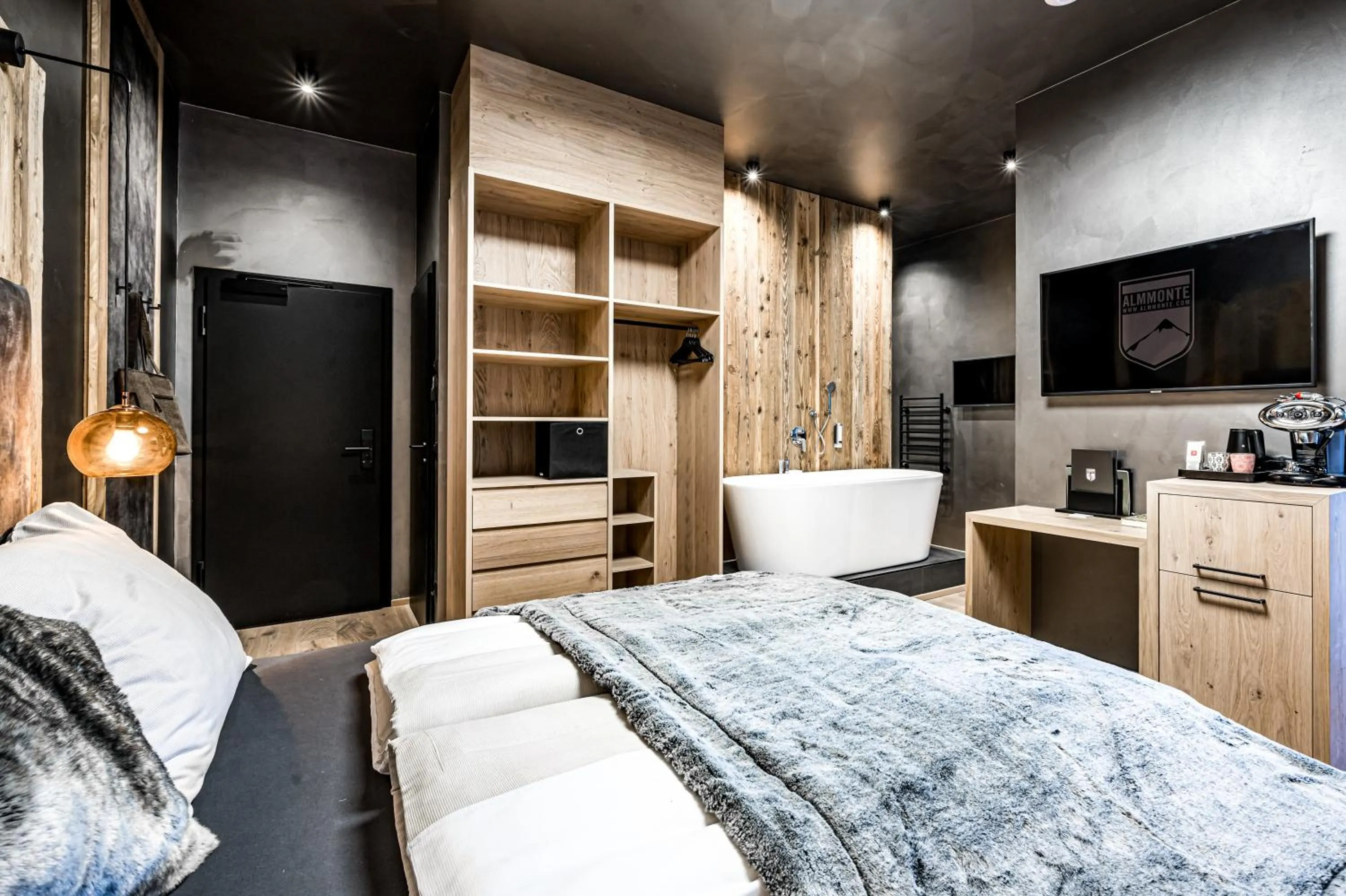 Bed in ALMMONTE PRÄCLARUM SUITES - Casual Boutique Hotel