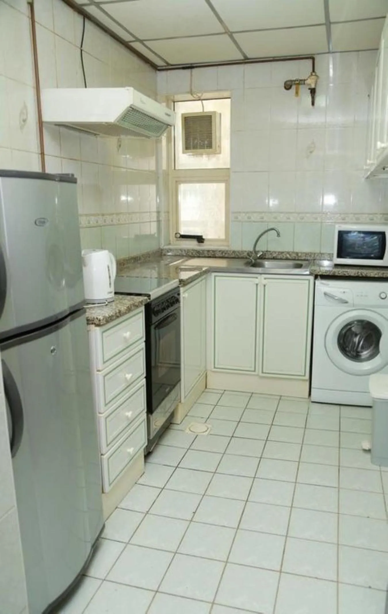 Kitchen or kitchenette in Al Sharq Hotels Suites