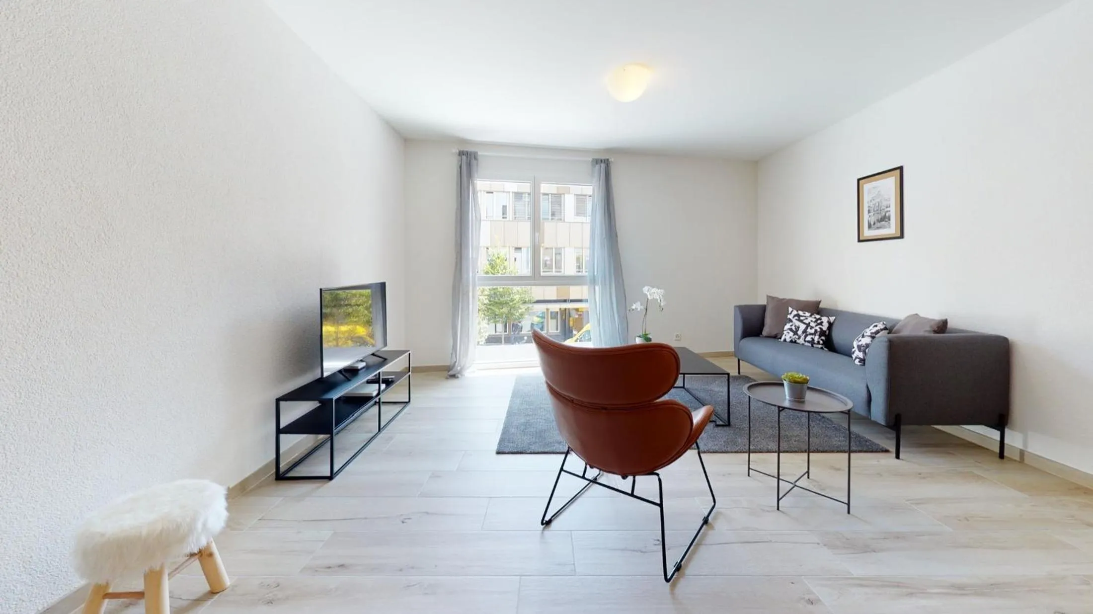 Living room in Nonanteneuf appart hōtel Aigle - contactless check-in