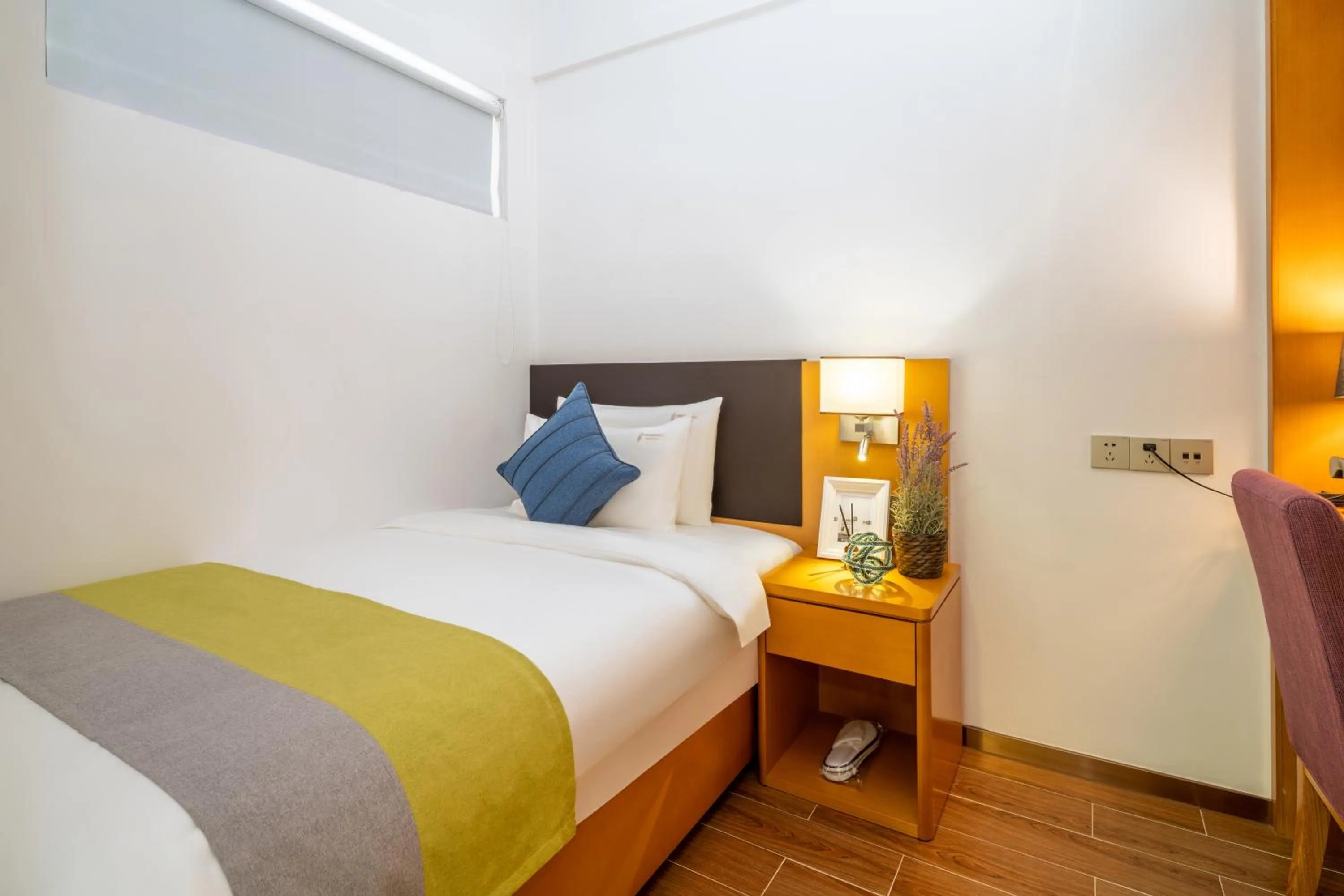 Bed in Dingshang Apartment Hotel