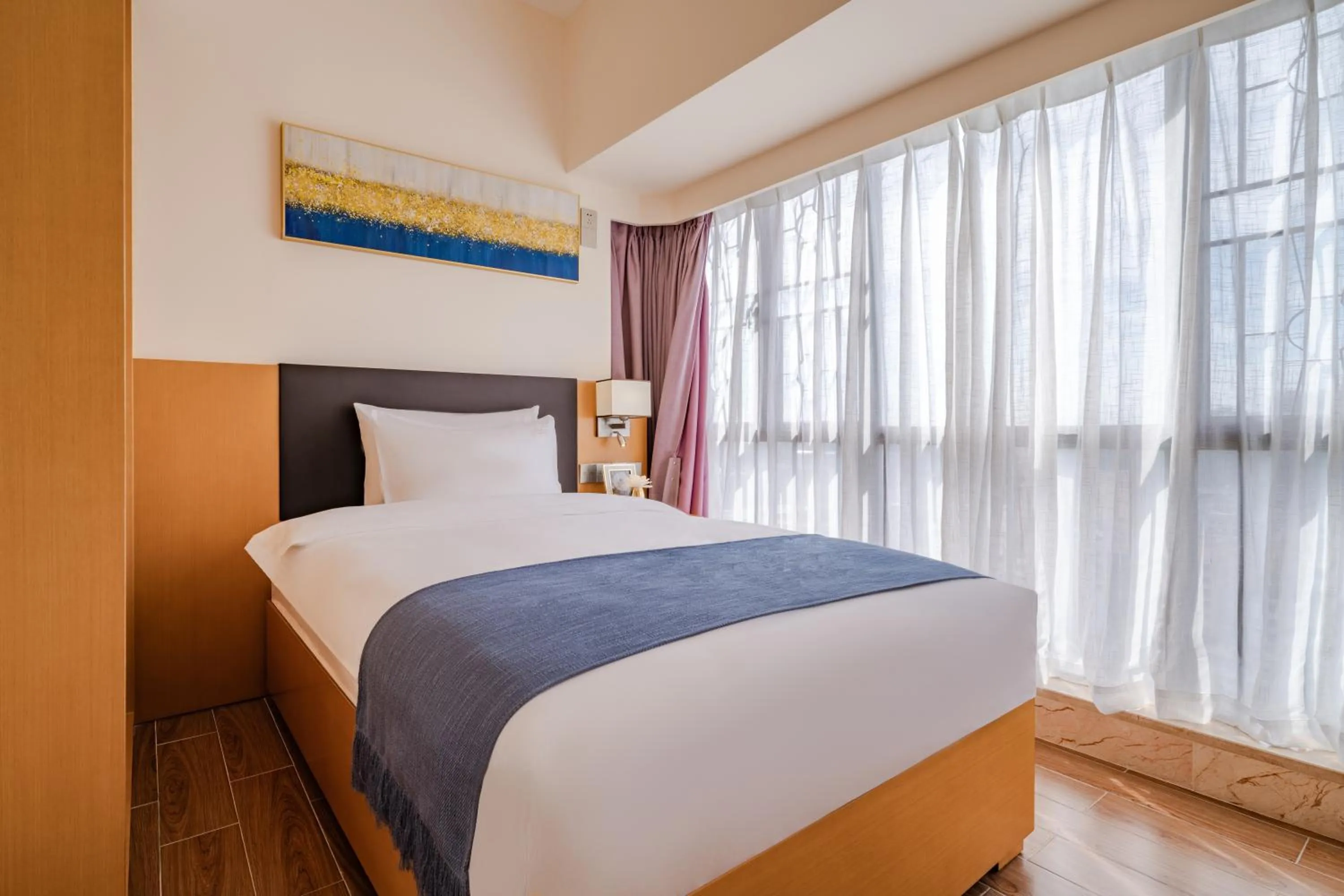 Bed in Dingshang Apartment Hotel