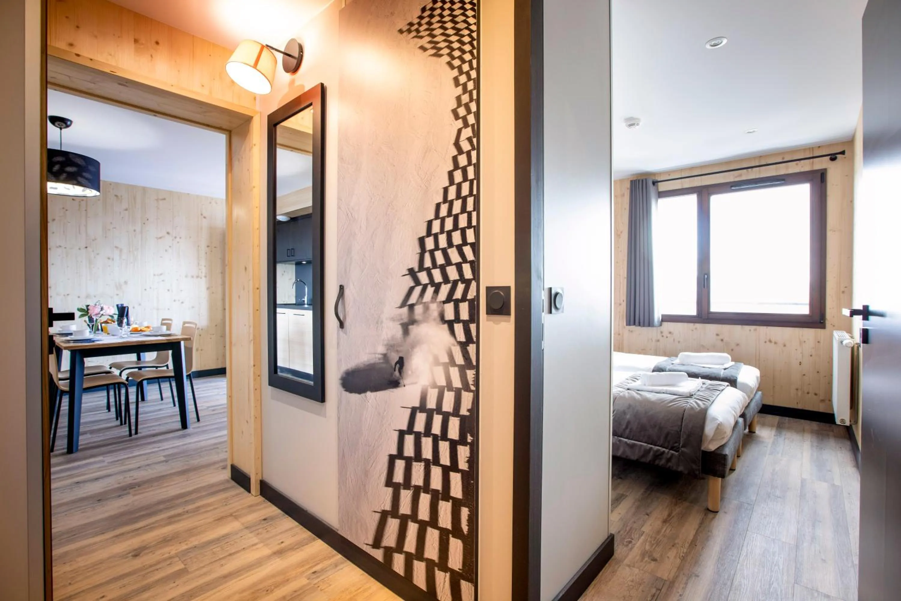 Living room, Bed in Résidence Club MMV L'Etoile des Sybelles