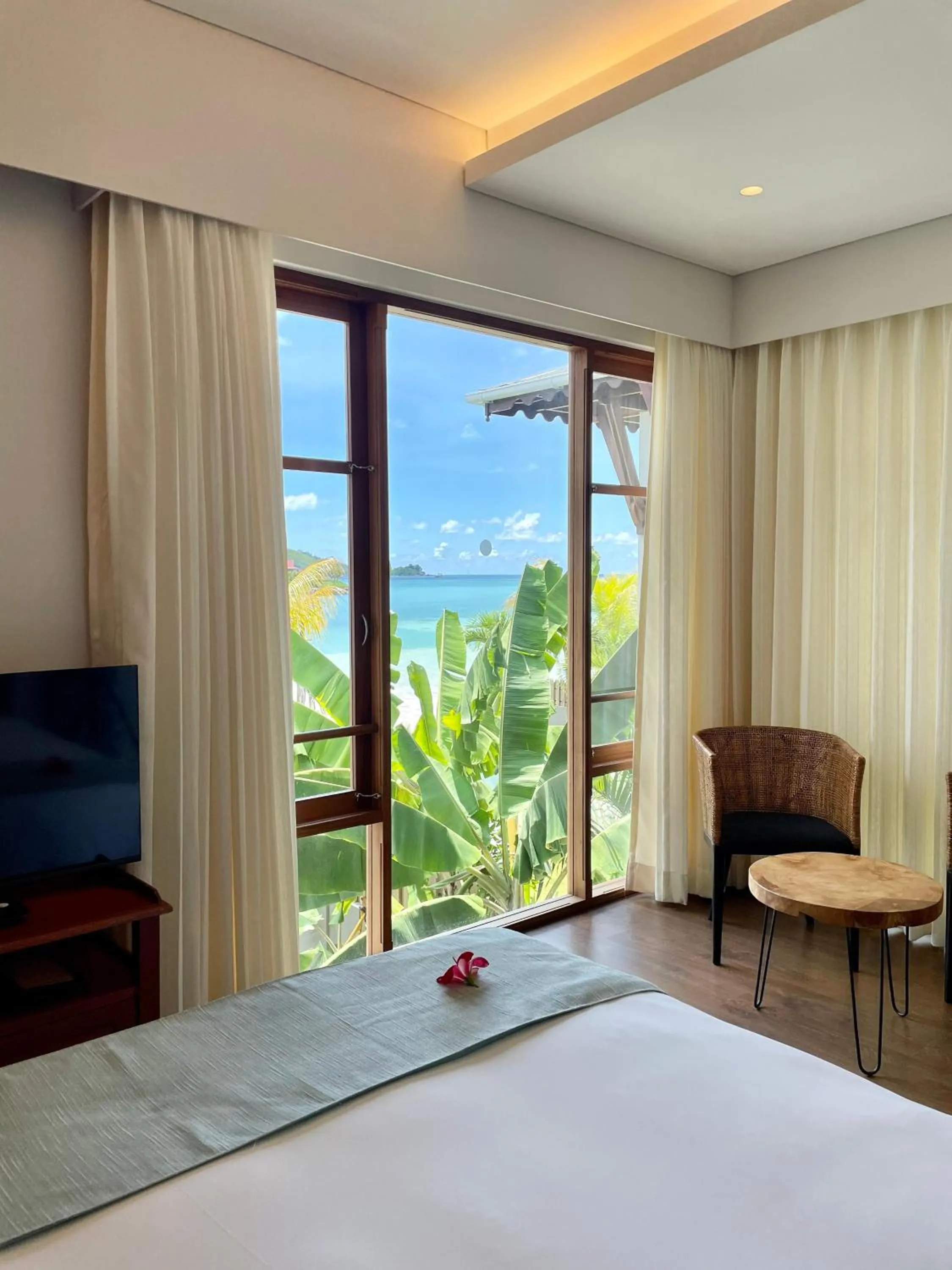 Photo of the whole room, Bed in JA Enchanted Waterfront Seychelles