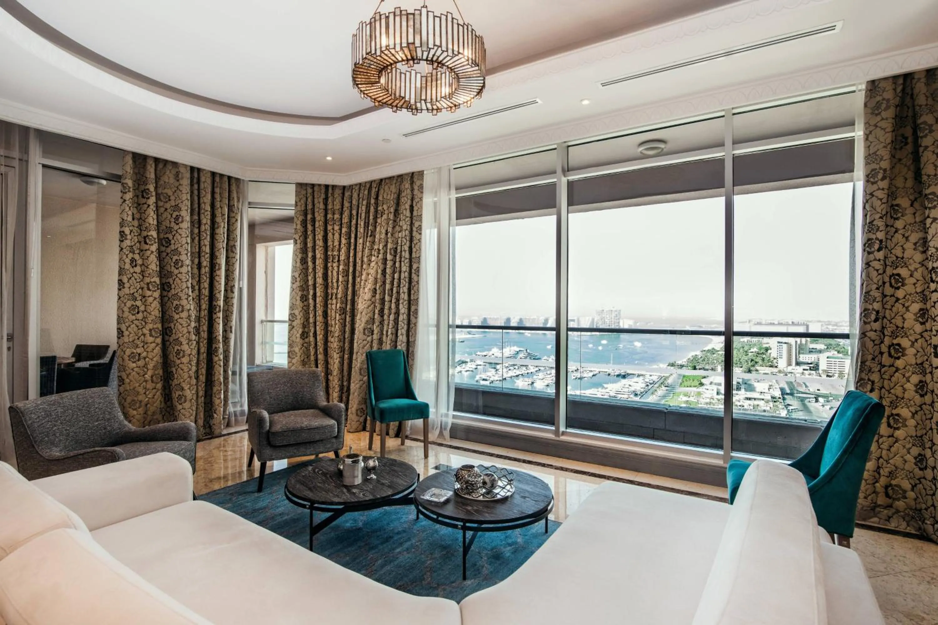 Living room, Bed in Al Habtoor Grand Resort, Autograph Collection