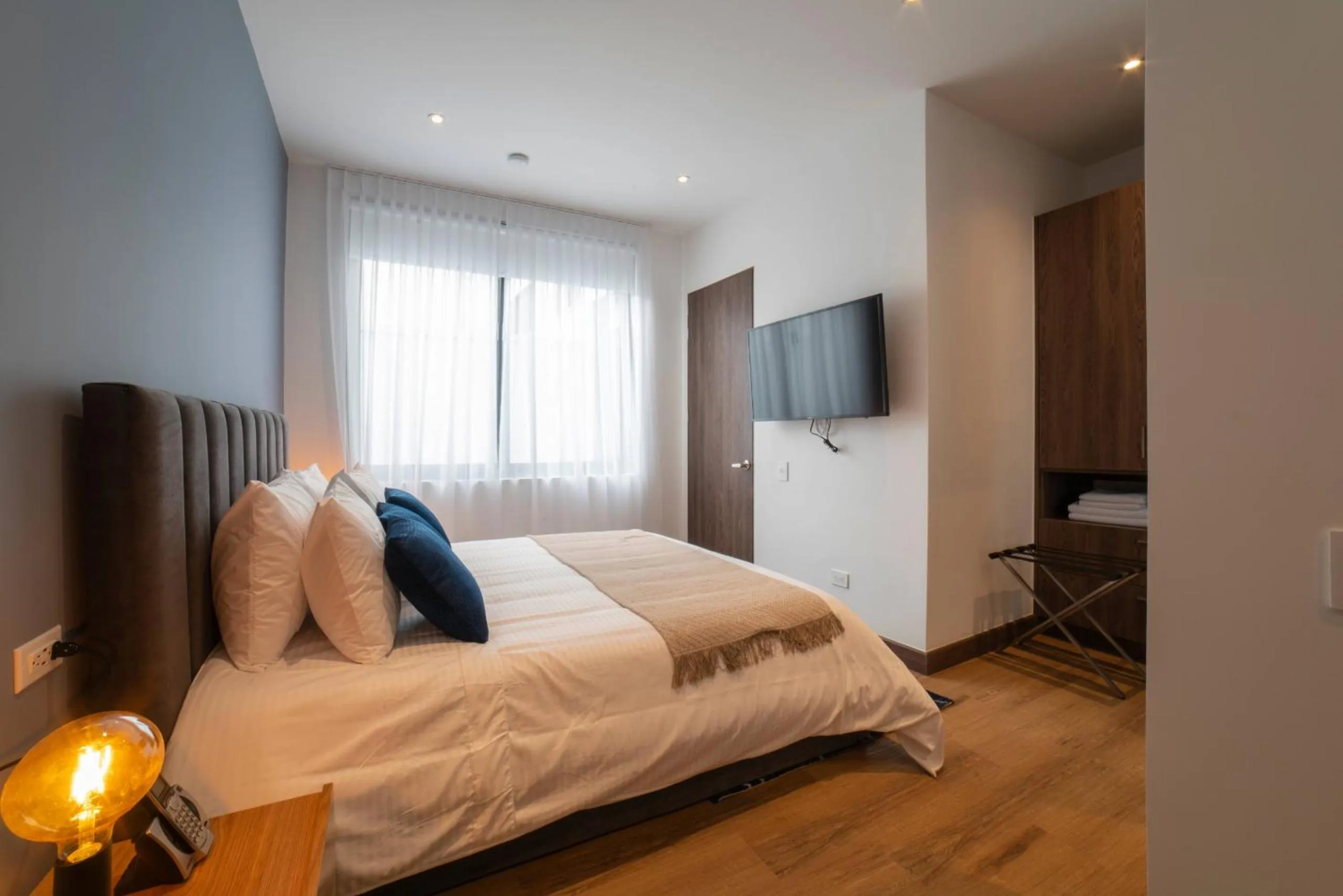 Bed in Cali River Suites by Yellowkey Capital