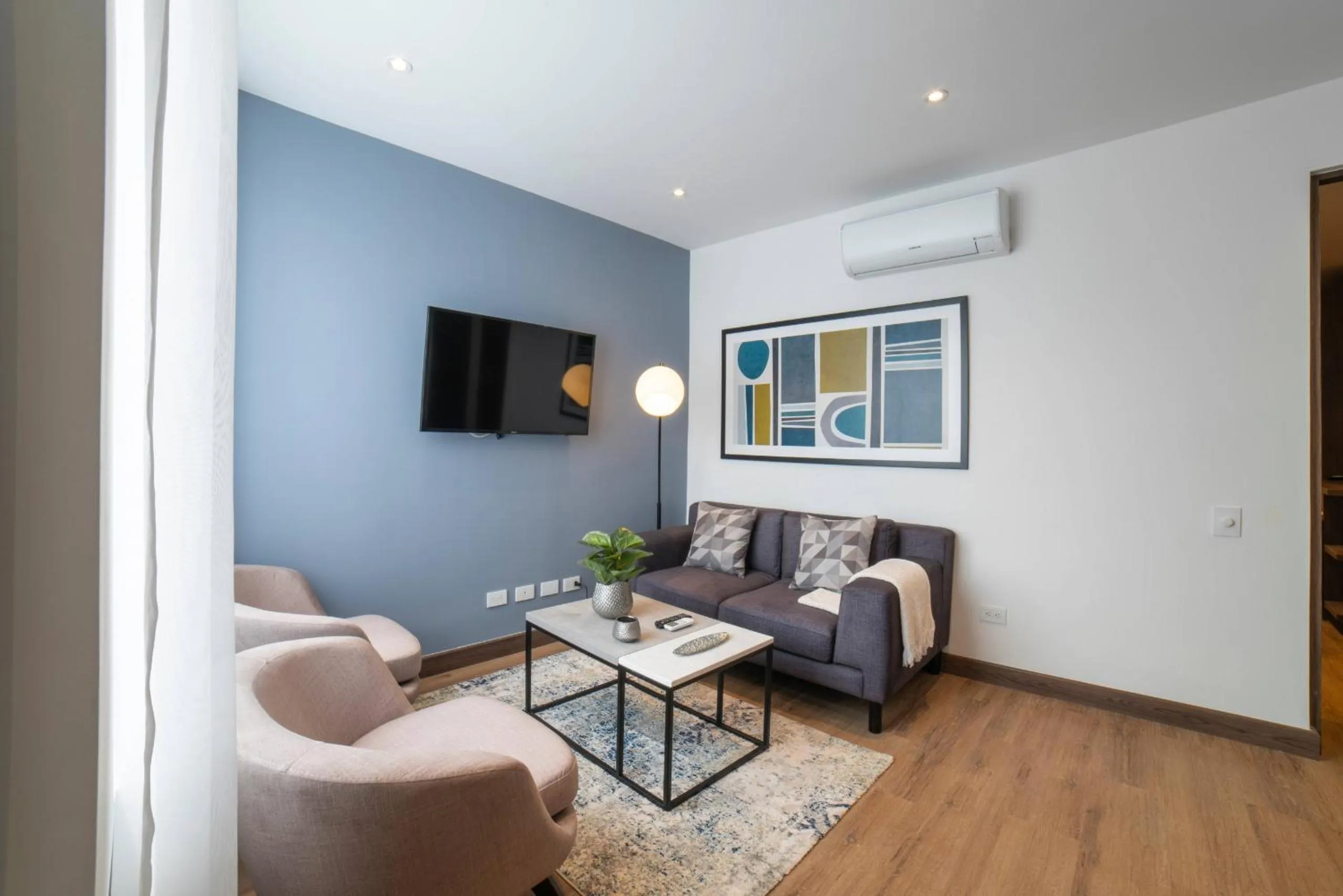 Communal lounge/ TV room in Cali River Suites by Yellowkey Capital