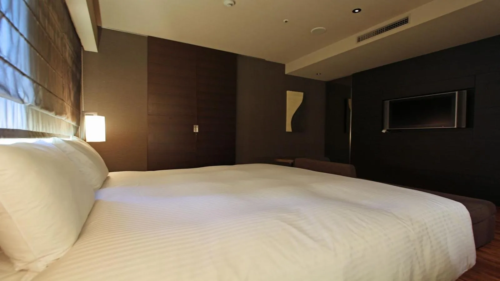 Bed in KOKO HOTEL Fukuoka Tenjin