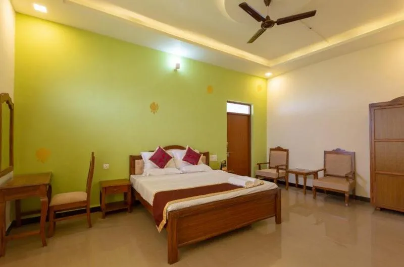 Bed in KSTDC Hotel Mayura Krishna Almatti