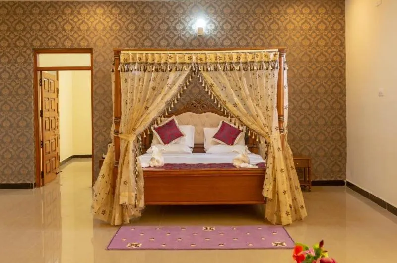 Bed in KSTDC Hotel Mayura Krishna Almatti