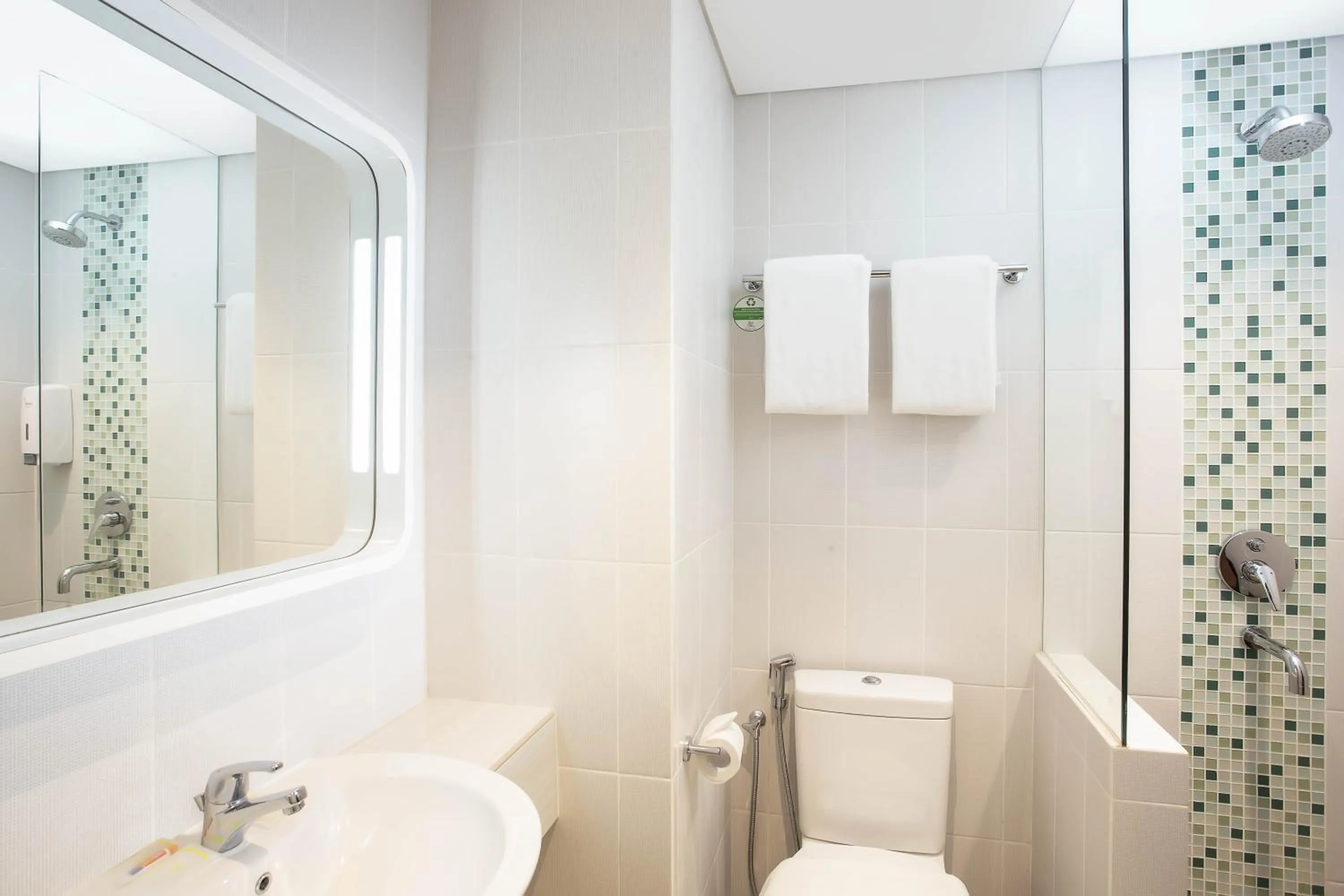 Bathroom in Zest Parang Raja Solo by Swiss-Belhotel International