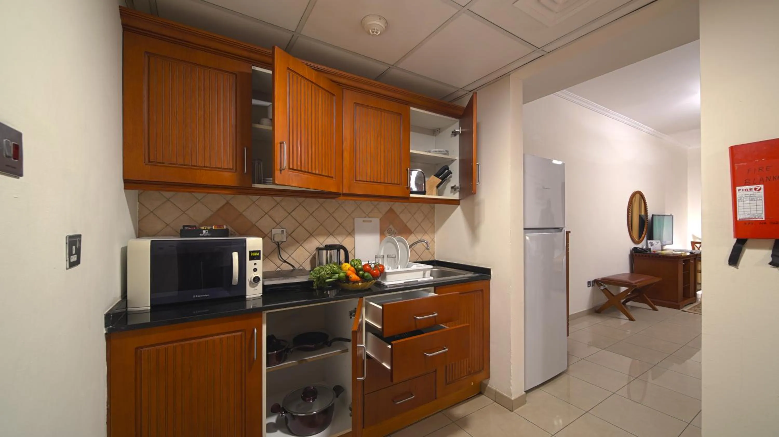 Kitchen or kitchenette in Rose Garden Hotel Apartments - Bur Dubai