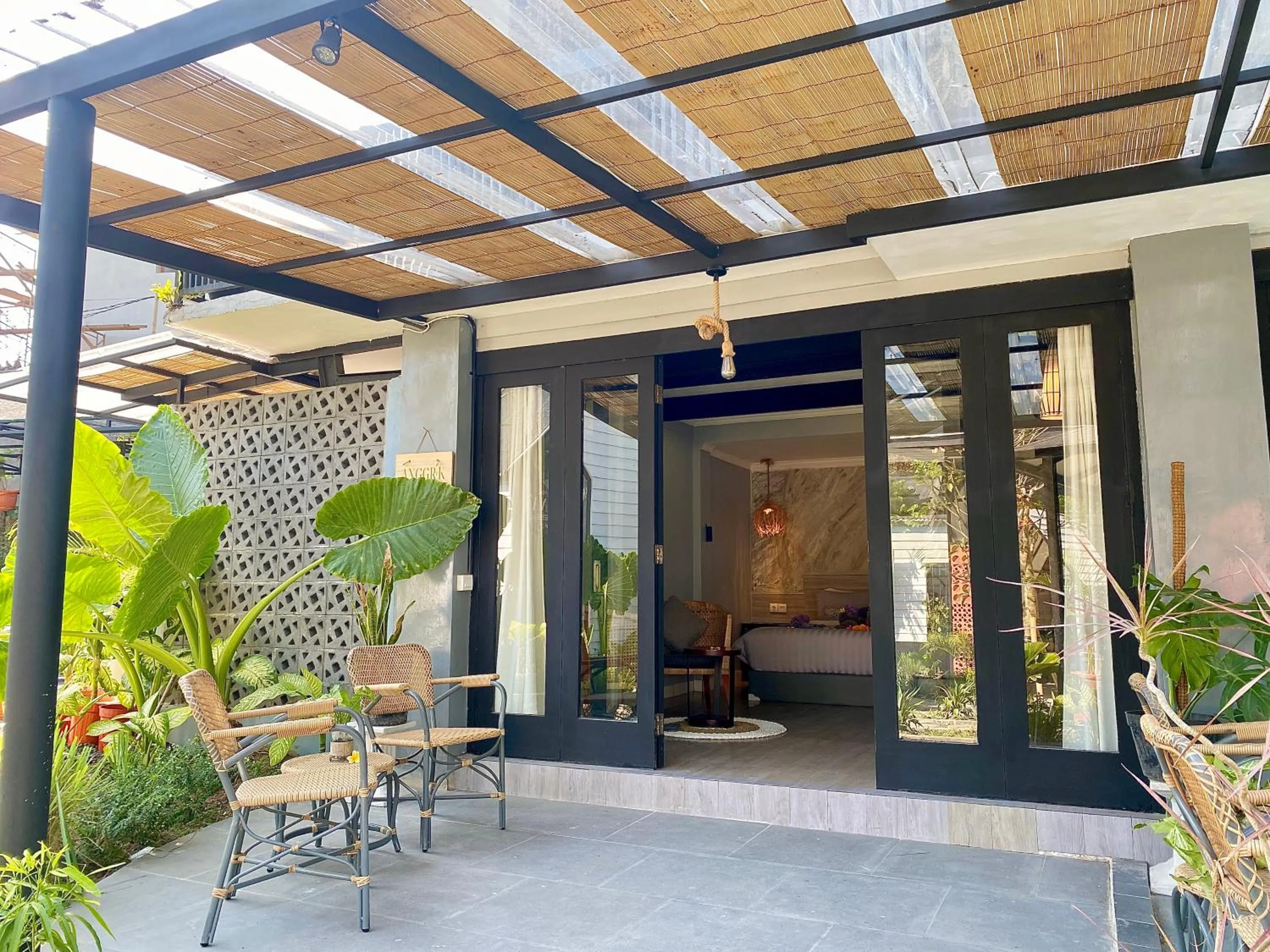 Seating area in The Jungle Hostel Canggu