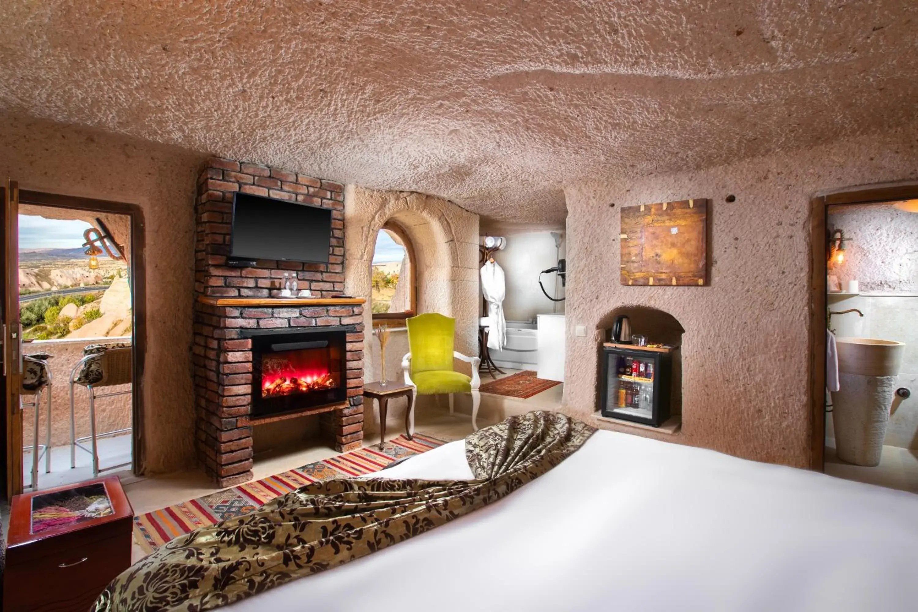 Winery Cave Room with Small Balcony and Balloon View in Cappadocia Fairy Chimneys Selfie Cave Hotels - Special Class Winery Cave Room with Small Balcony and Balloon View in Cappadocia Fairy Chimneys Selfie Cave Hotels - Special Class