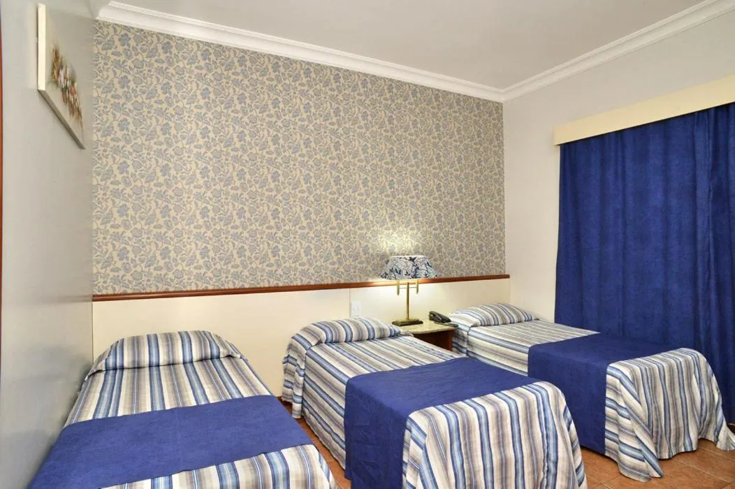 Bed in Hotel Colonial Plaza