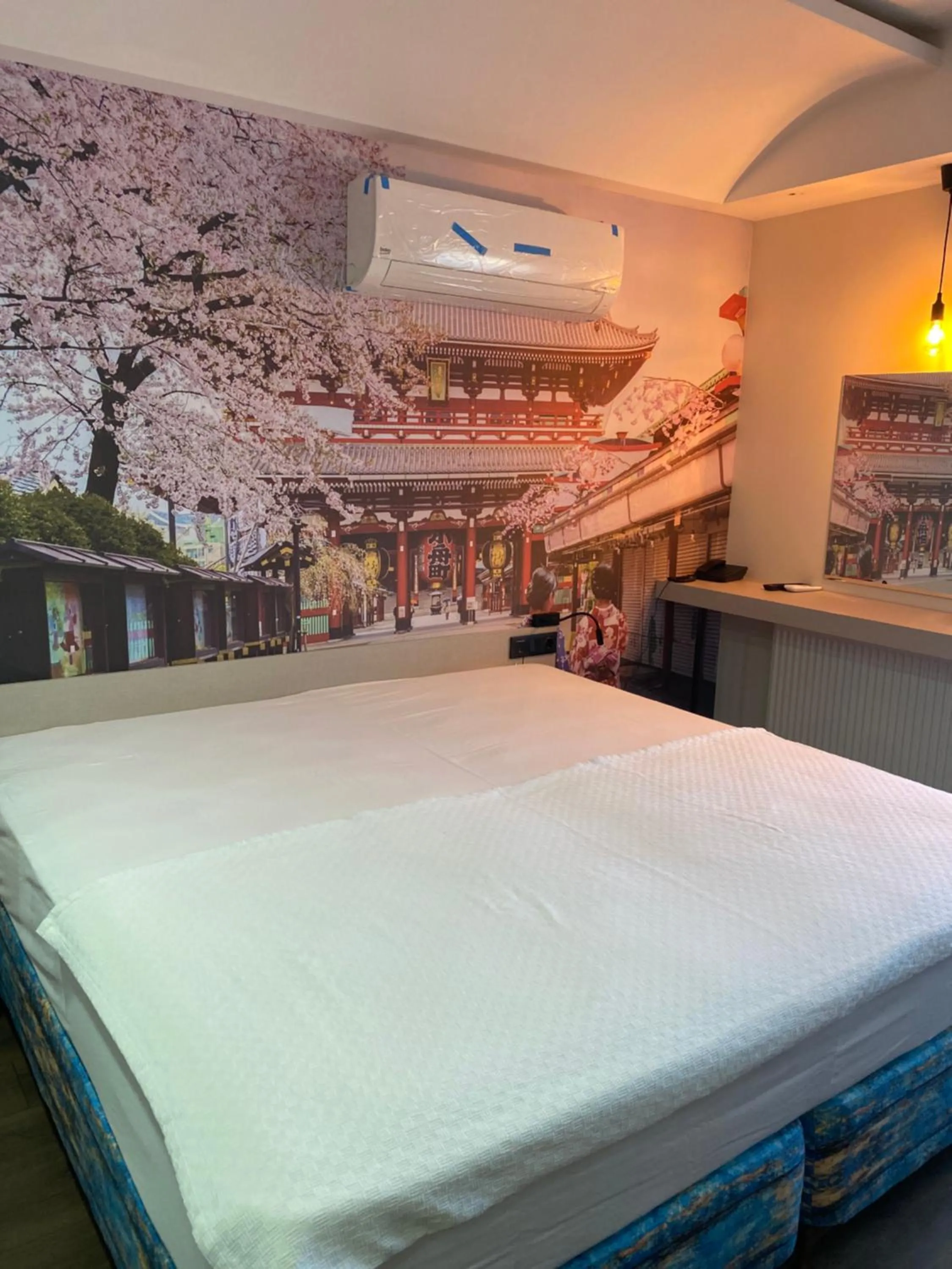 Bed in OFURO WORLD HOTEL SPA