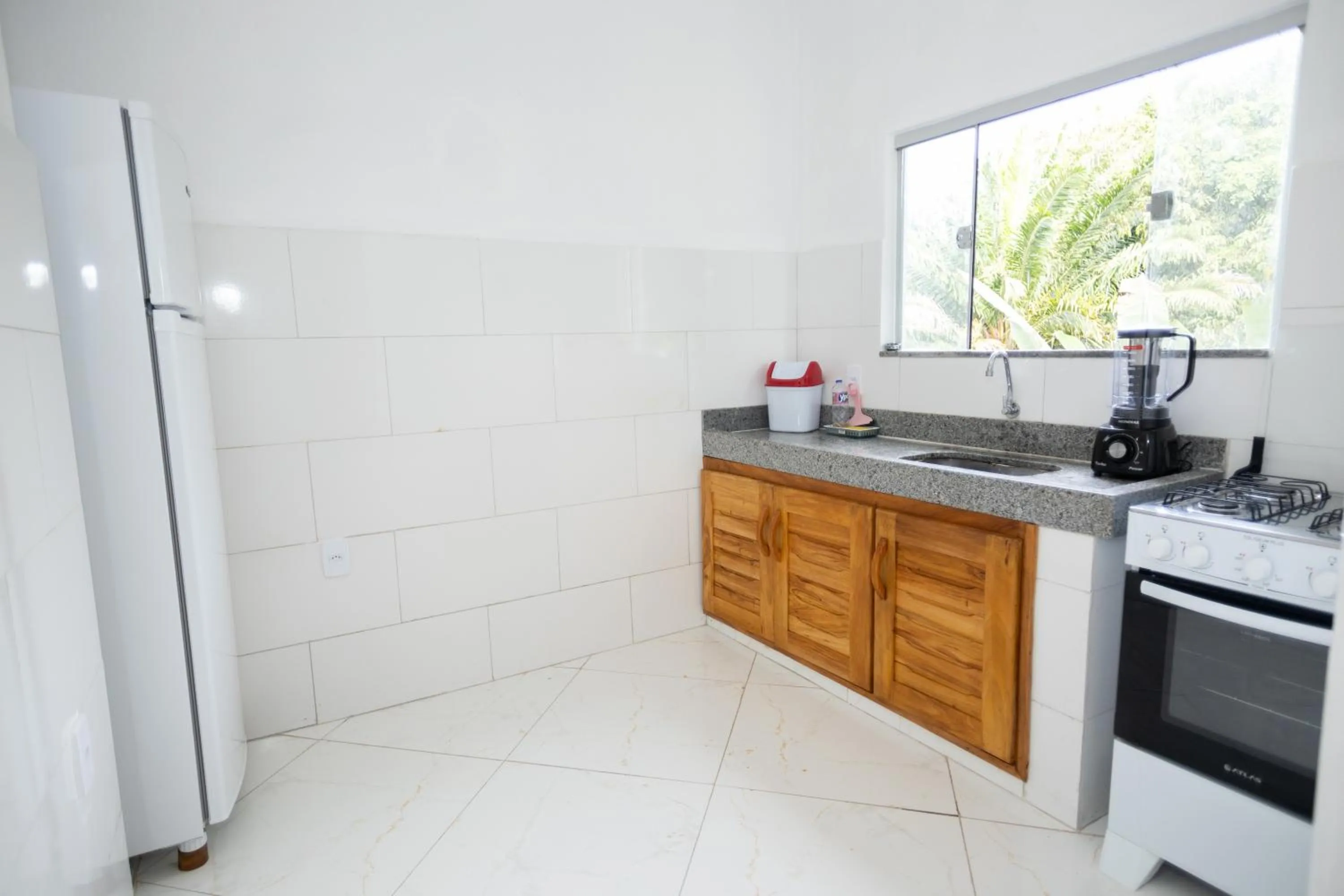 Kitchen or kitchenette in Pousada Flor do Arraial