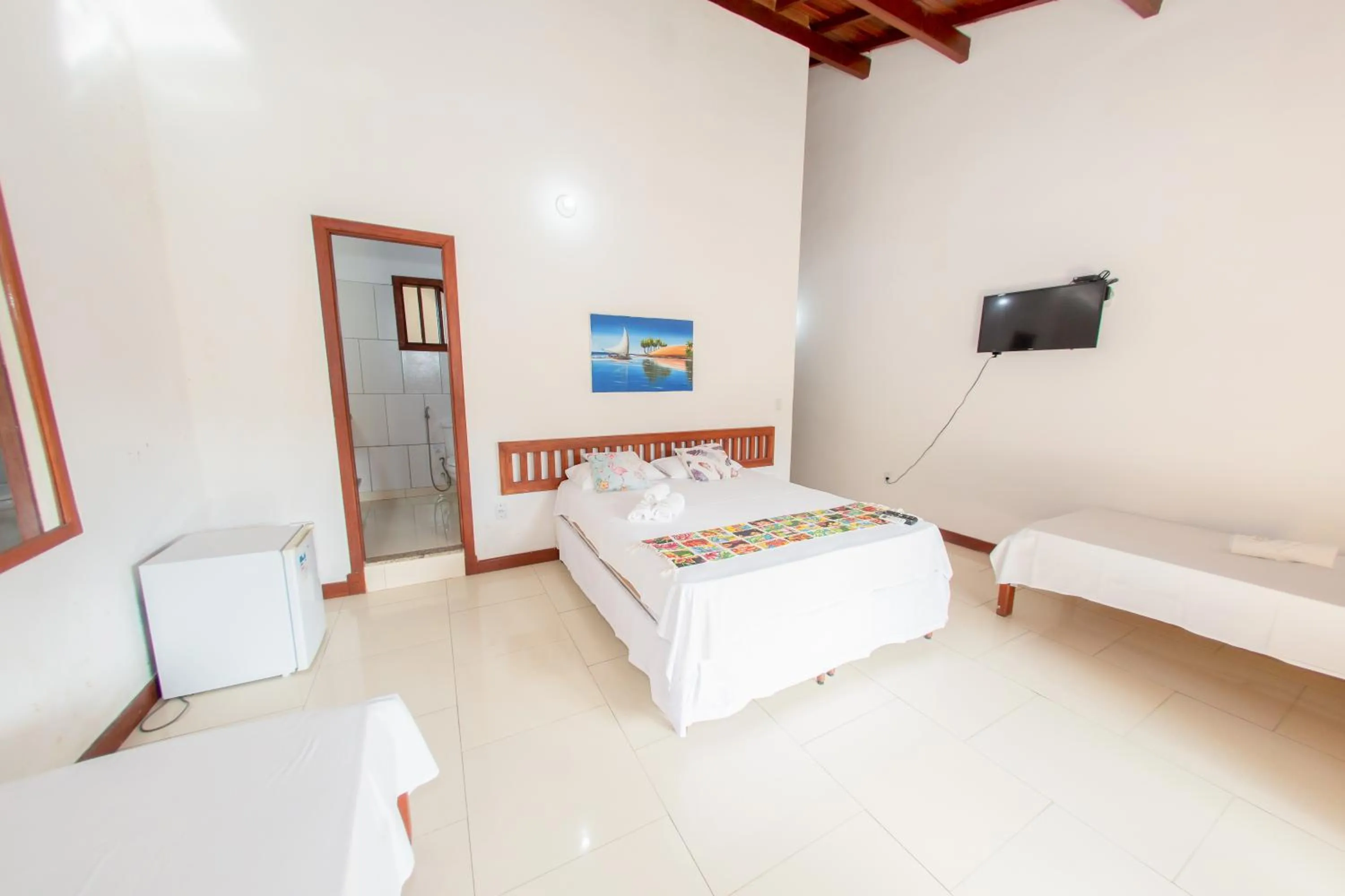 Bed in Pousada Flor do Arraial