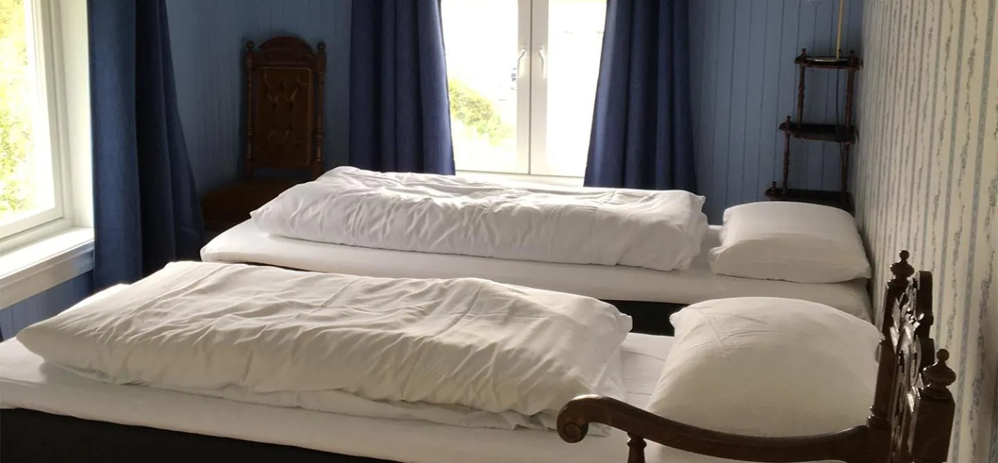 Bed in Kabelvåg Feriehus & Camping