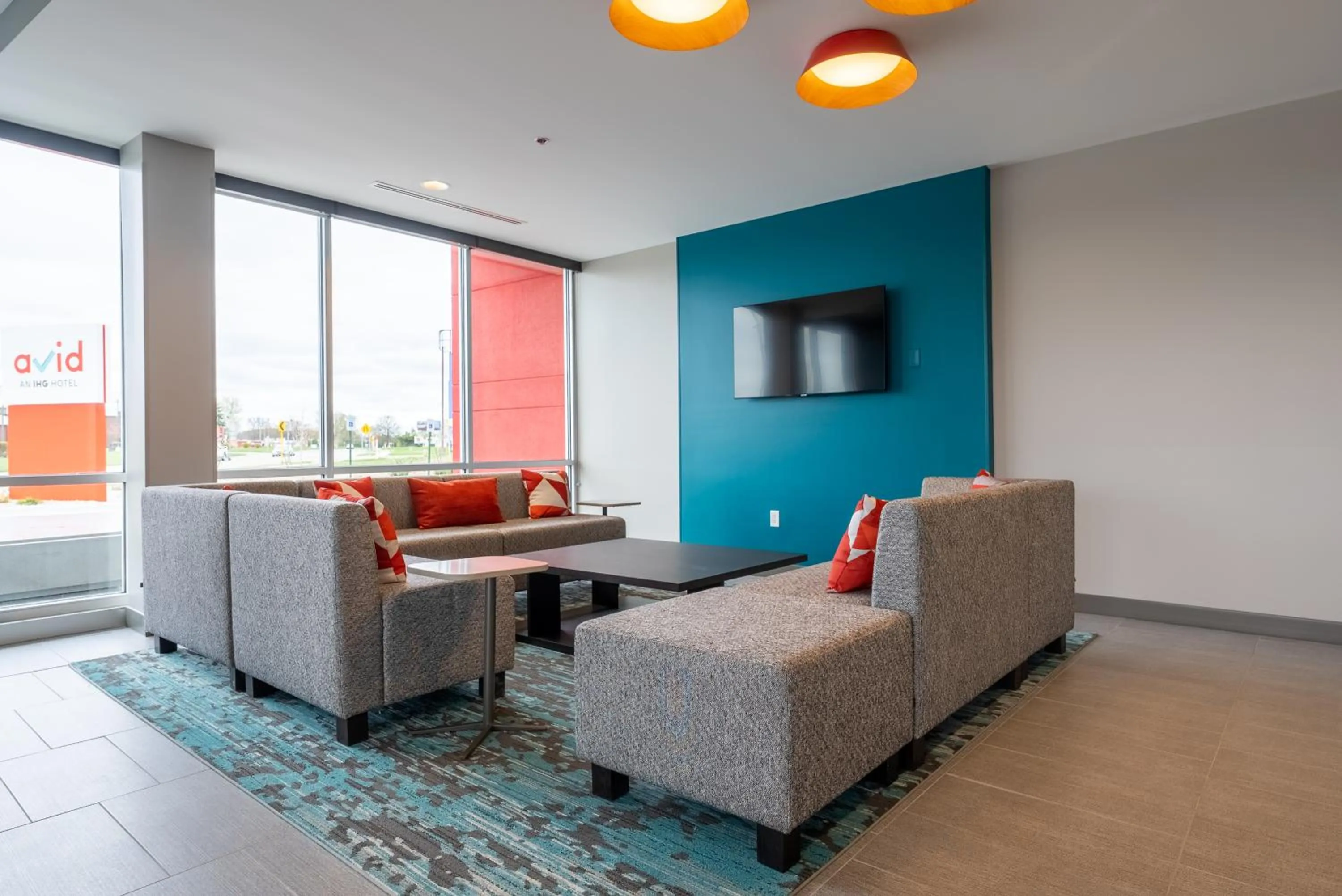 Seating area in avid hotels - Kalamazoo East by IHG