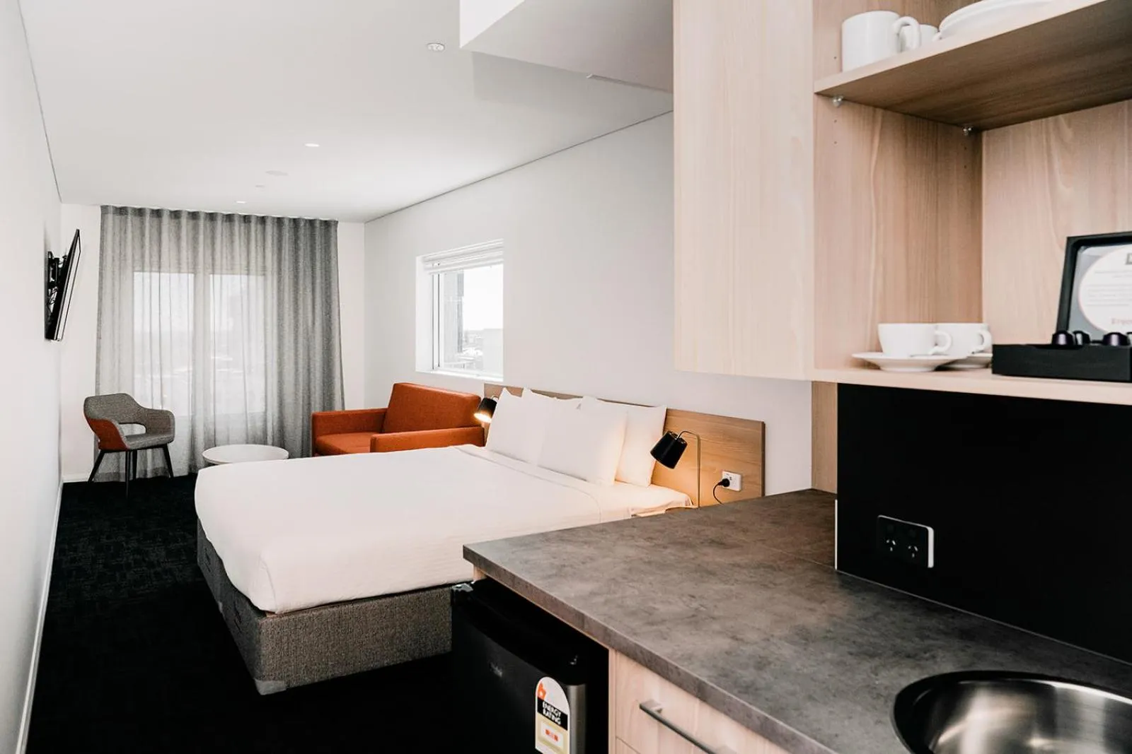 Seating area, Bed in Toms Court Hotel