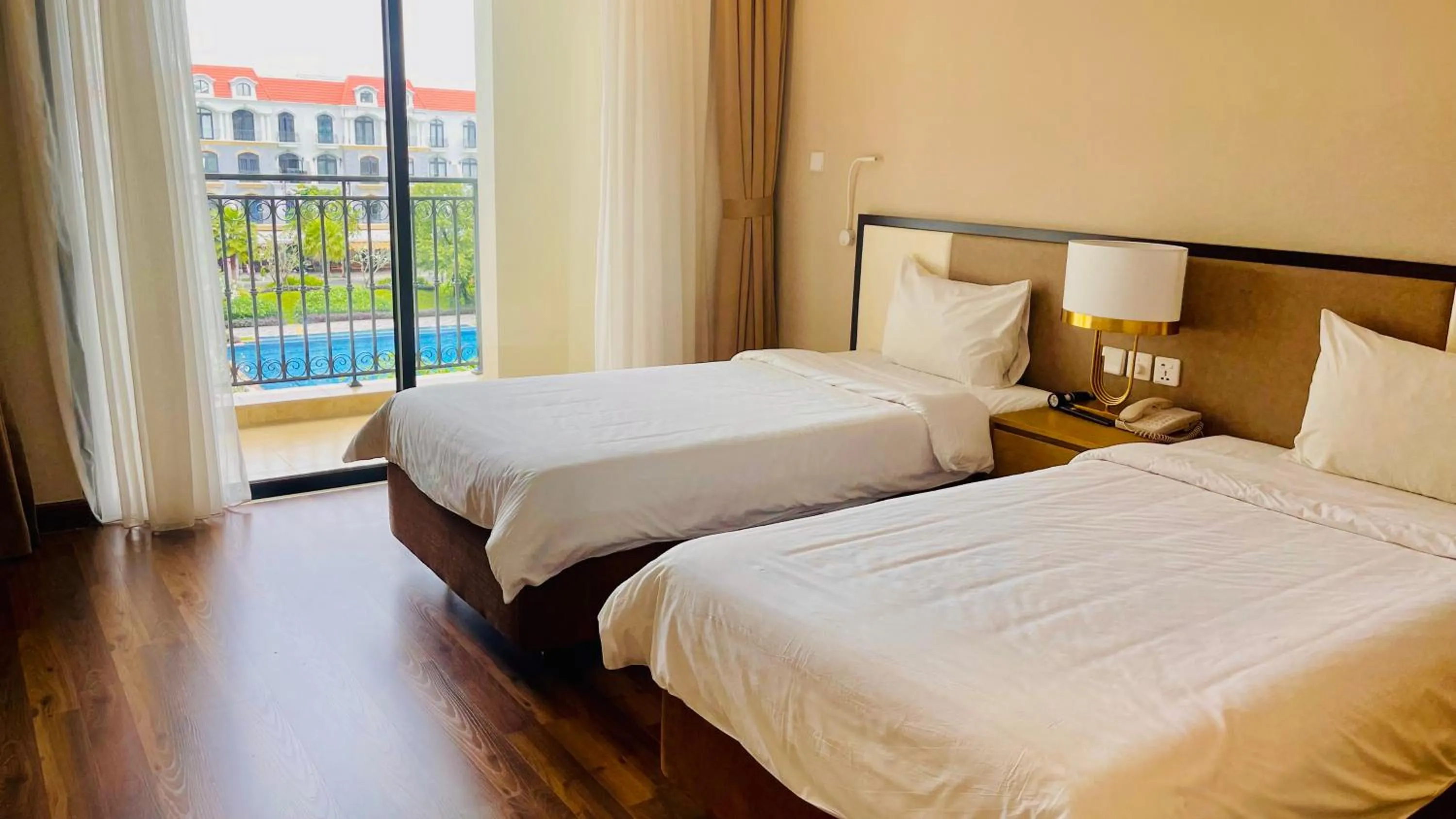 View (from property/room), Bed in Vinholidays Fiesta Phu Quoc