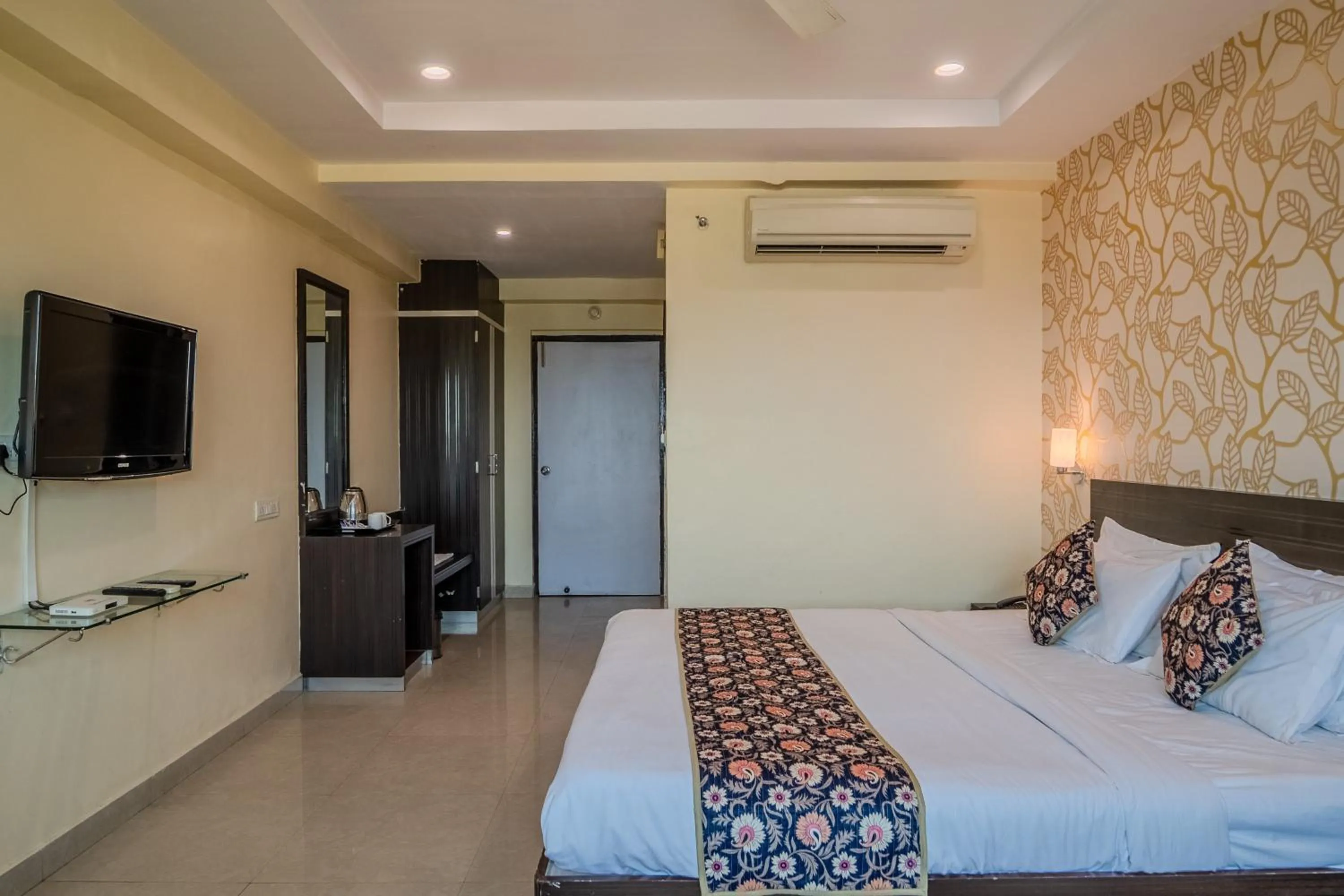 Photo of the whole room, Bed in Hotel City Square By KeyMagics