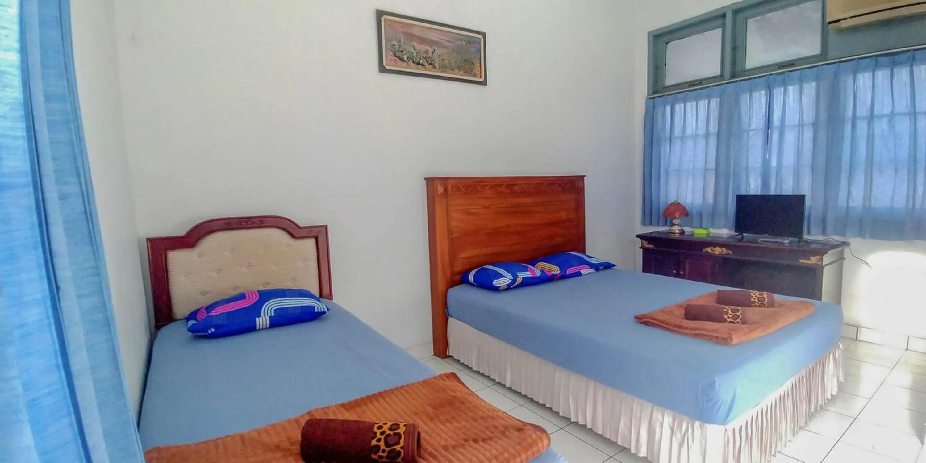 Bed in Hotel Rajawali Mitra RedDoorz