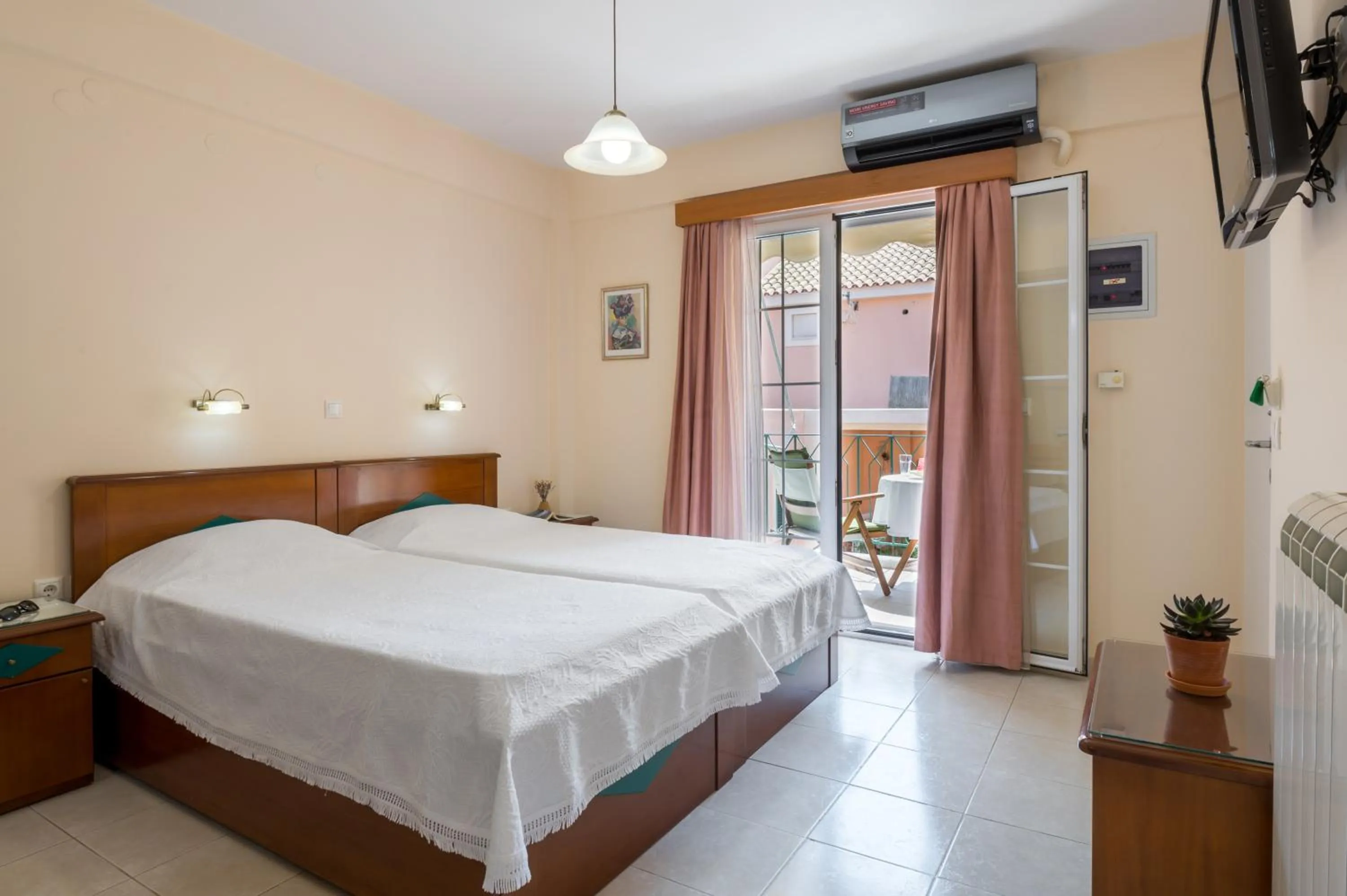 Bed in Rouchotas Apartments