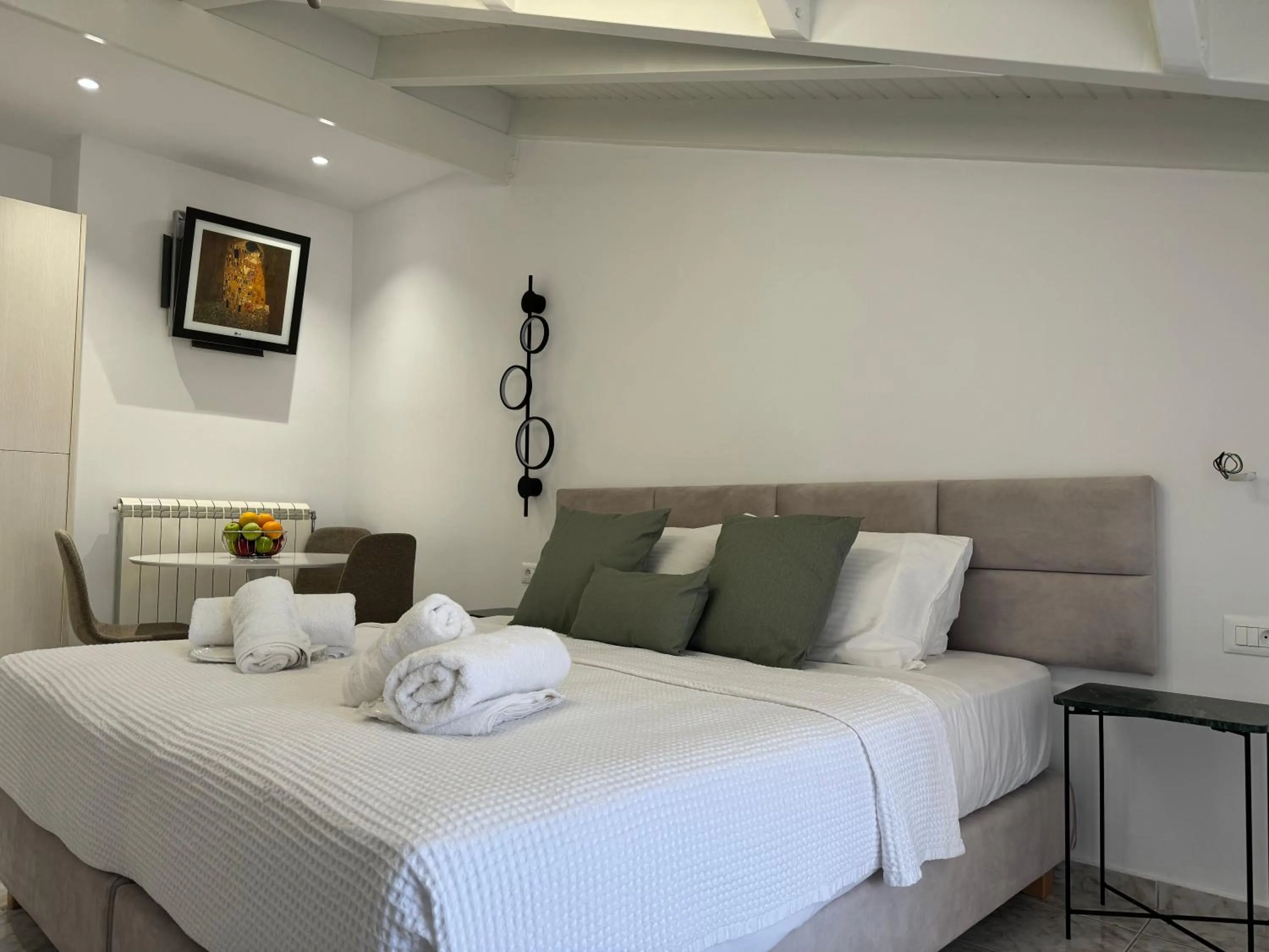 towels, Bed in Rouchotas Apartments