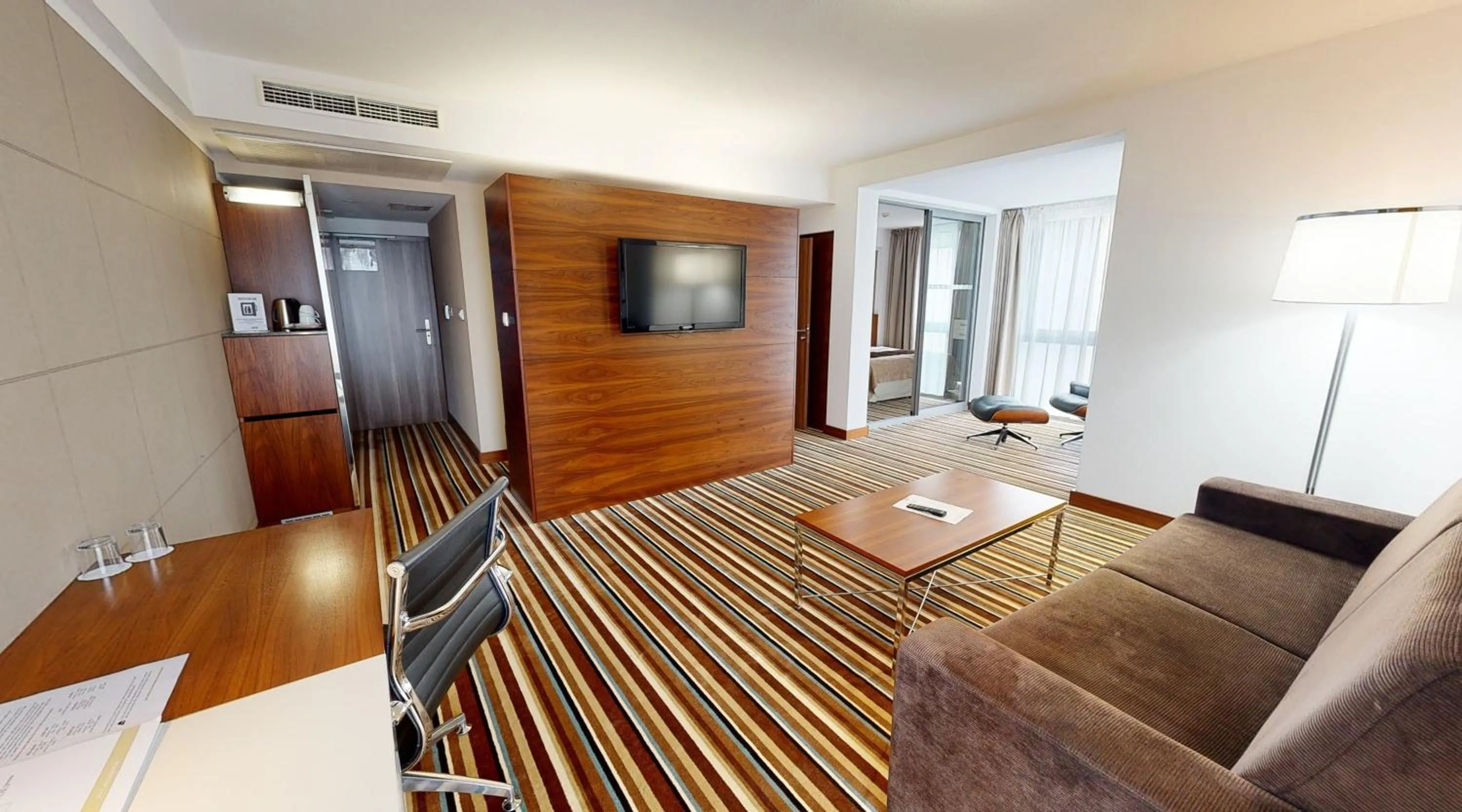 Communal lounge/ TV room in Business Hotel Astrum Laus