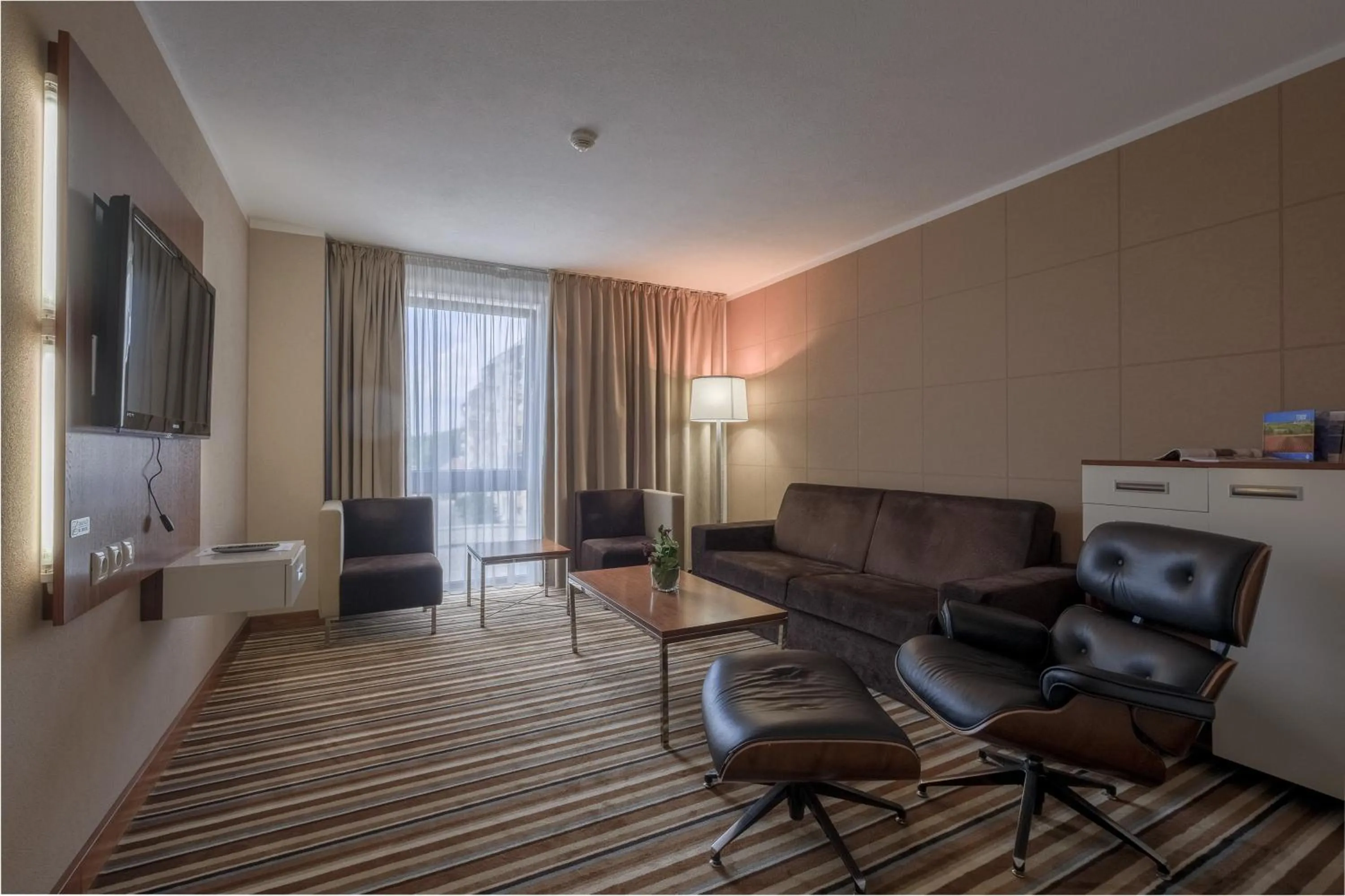 Communal lounge/ TV room in Business Hotel Astrum Laus