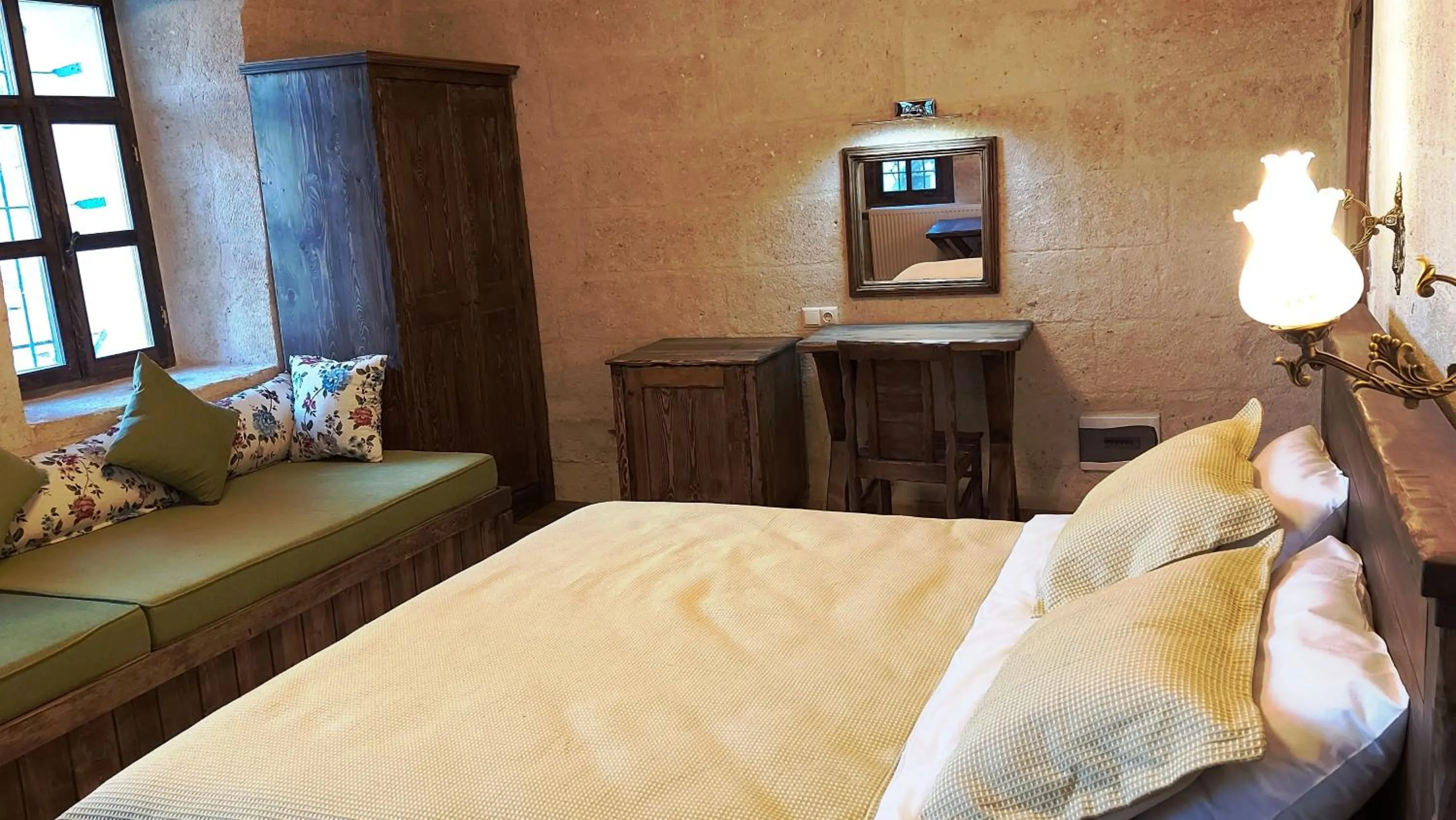 Bed in ARMEsos Cave Hotel