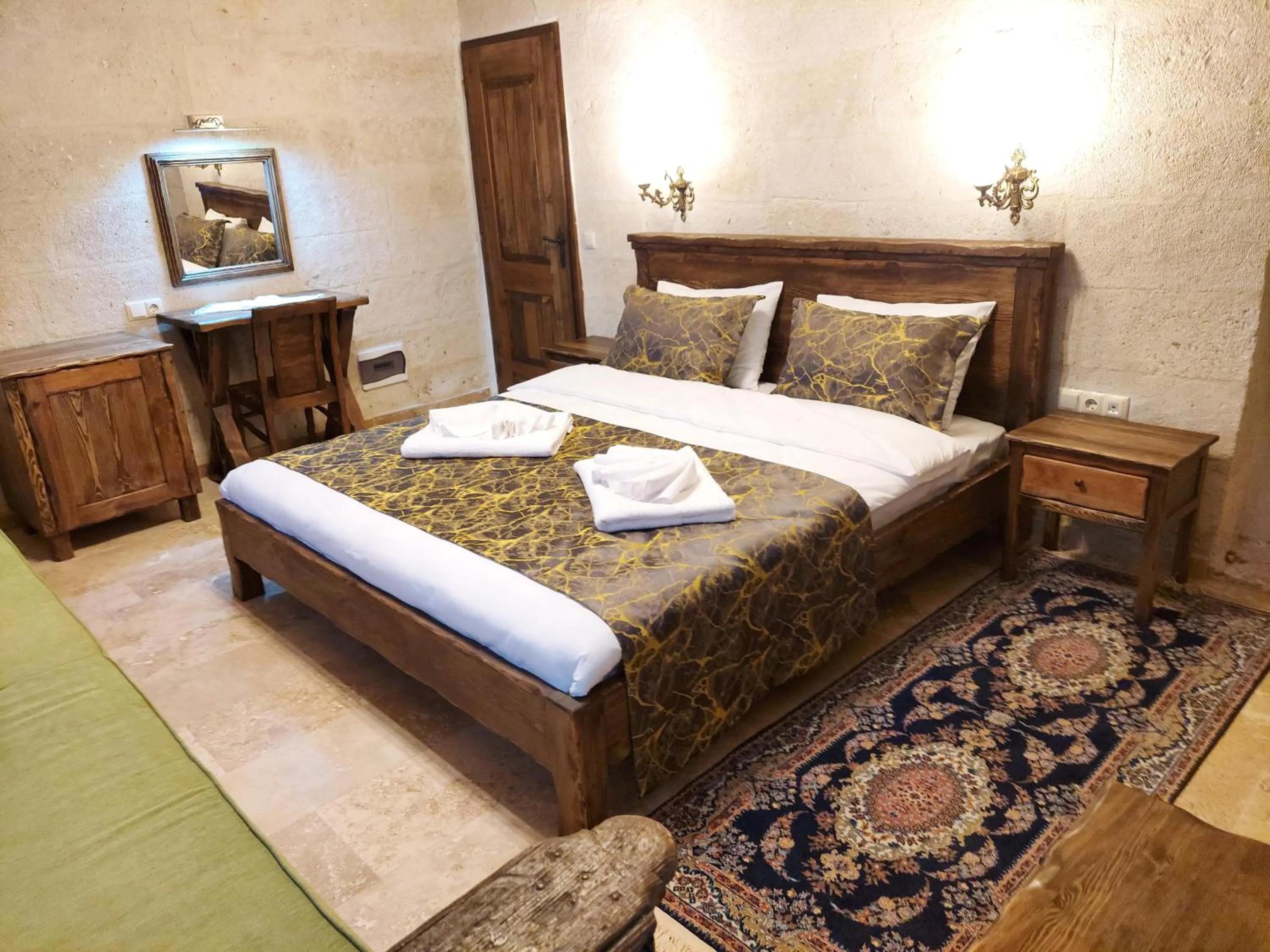 Bed in ARMEsos Cave Hotel